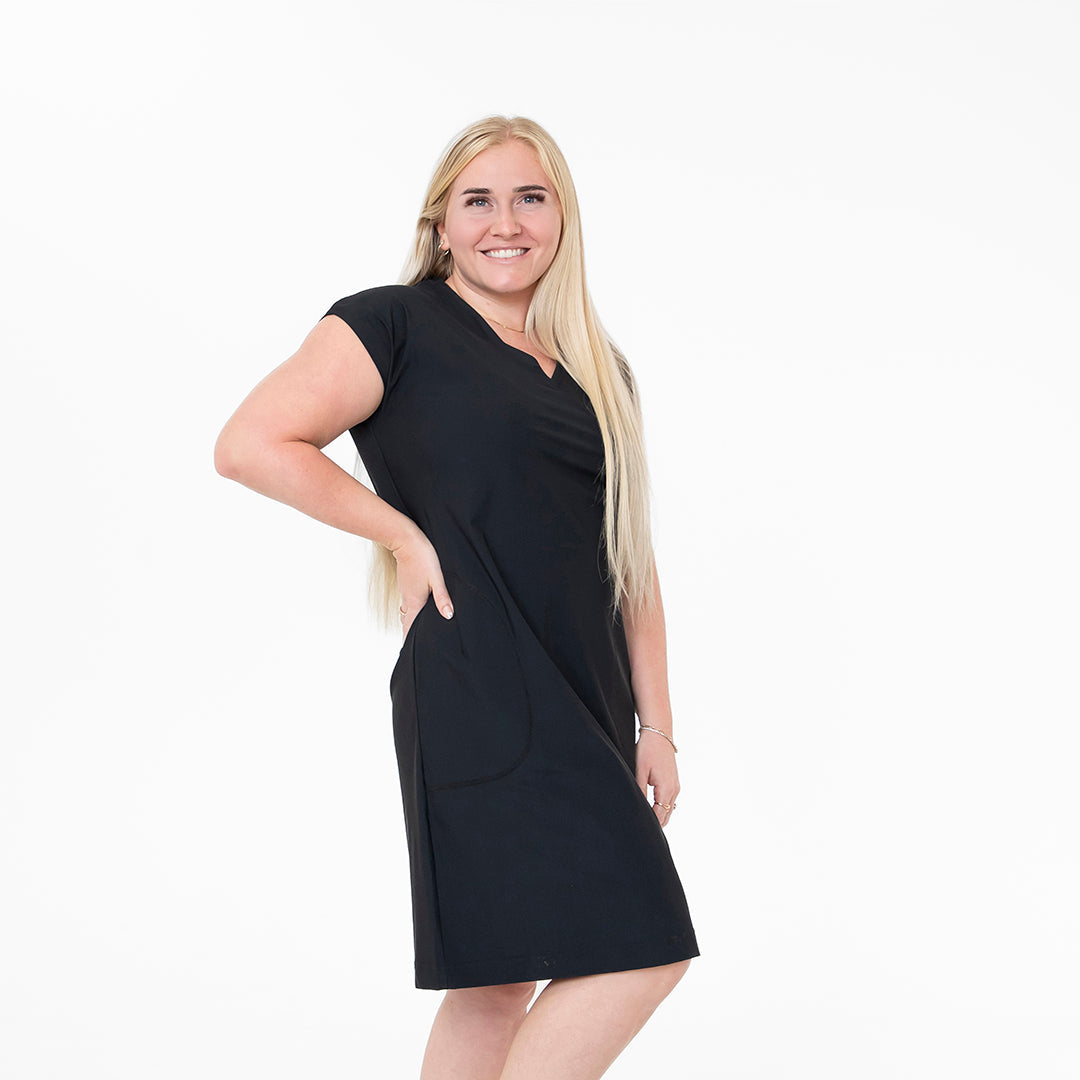 Woman wearing a black dress on a white background