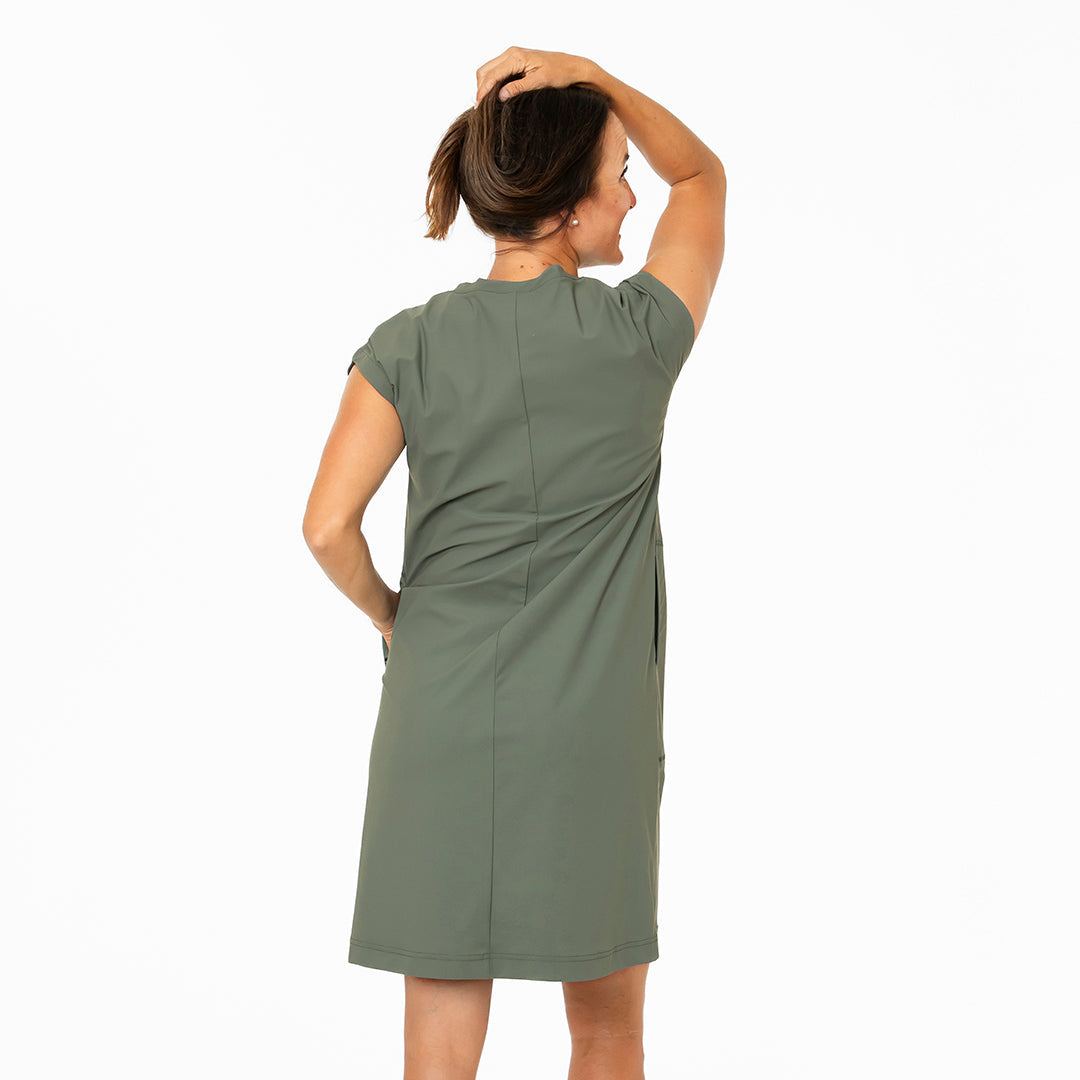 Woman wearing a green dress on a white background