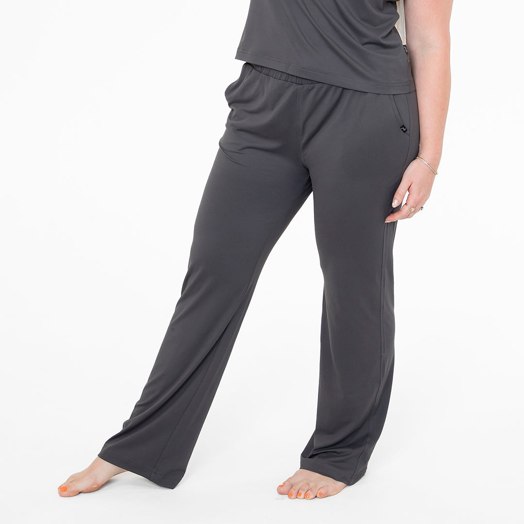 Person wearing gray pants on a white background