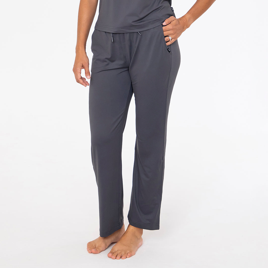 Person wearing gray pants on a white background