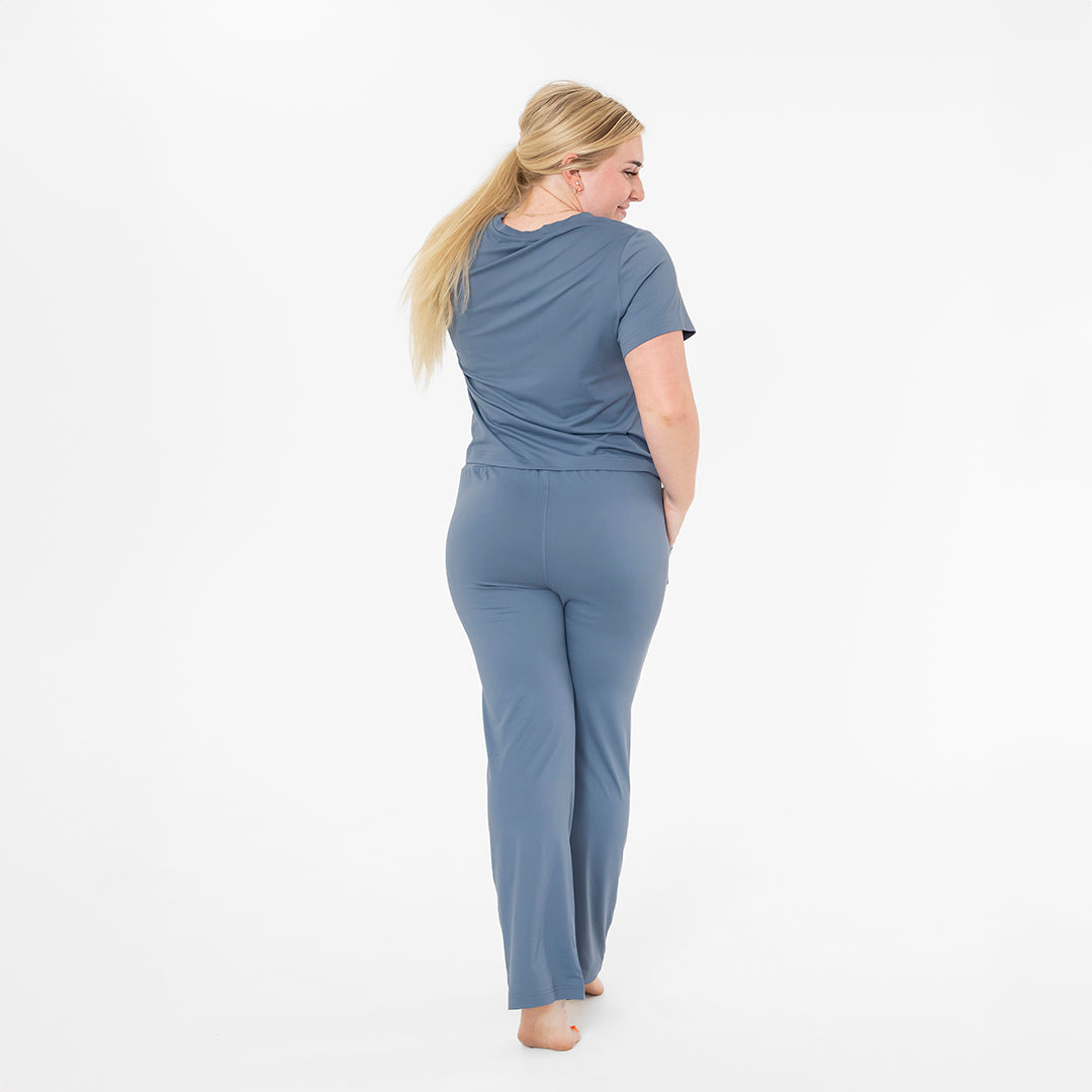 Woman wearing a blue outfit on a white background