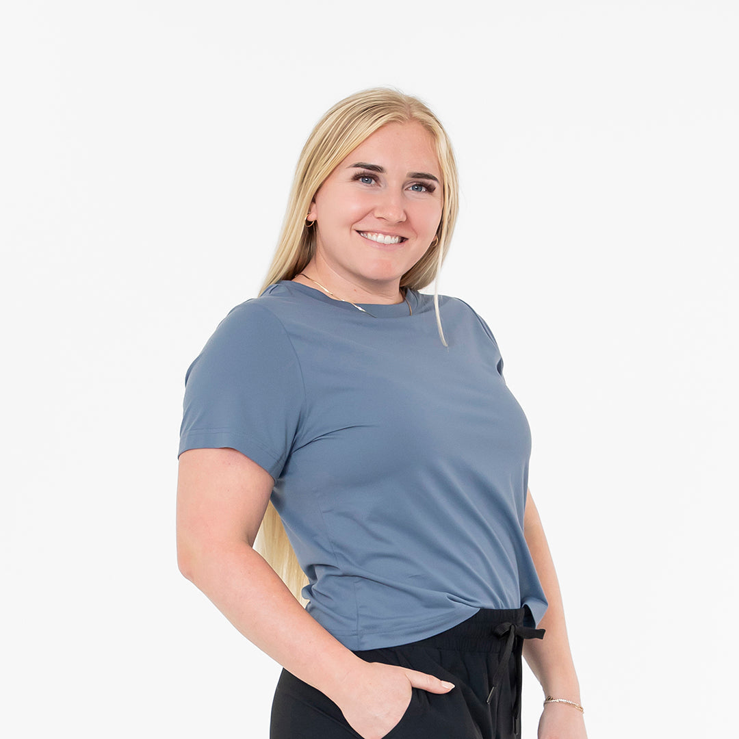 Woman wearing a blue t-shirt on a white background