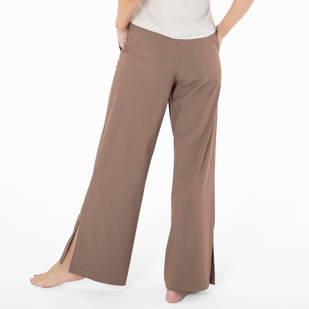 Brown wide-leg pants worn by a person on a white background