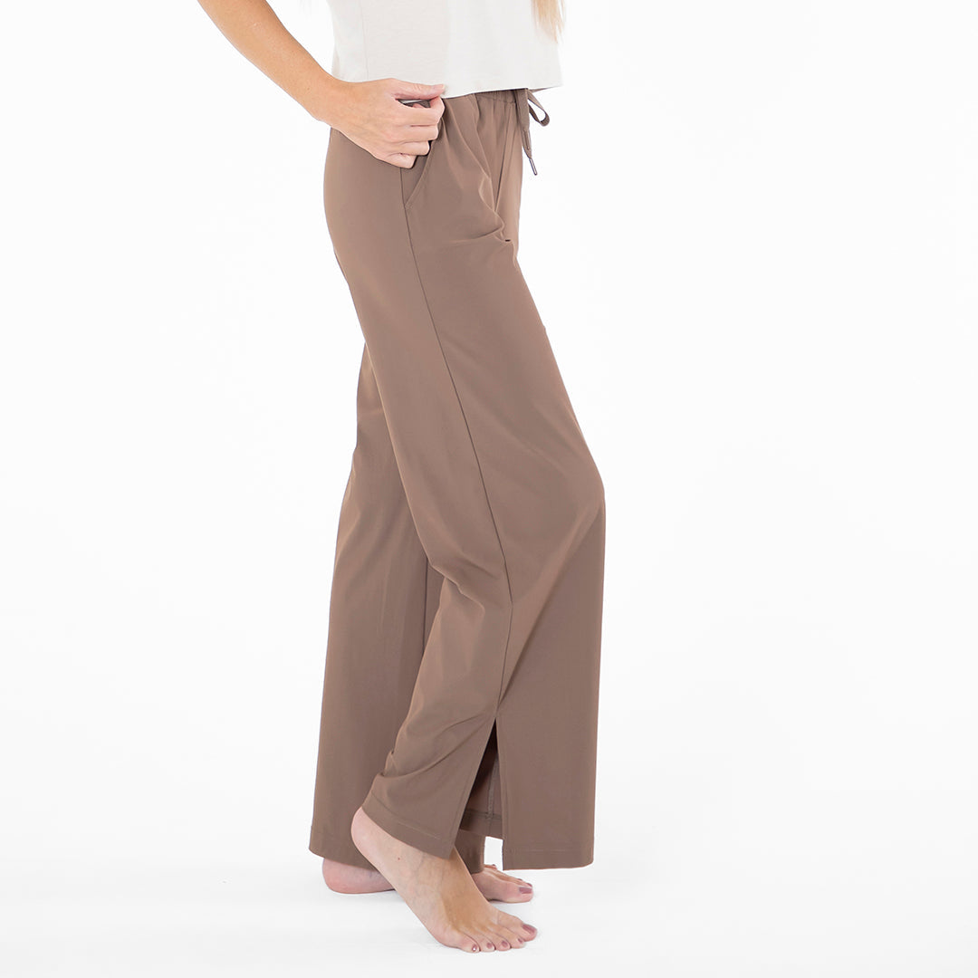 Brown wide-leg pants worn by a person on a white background