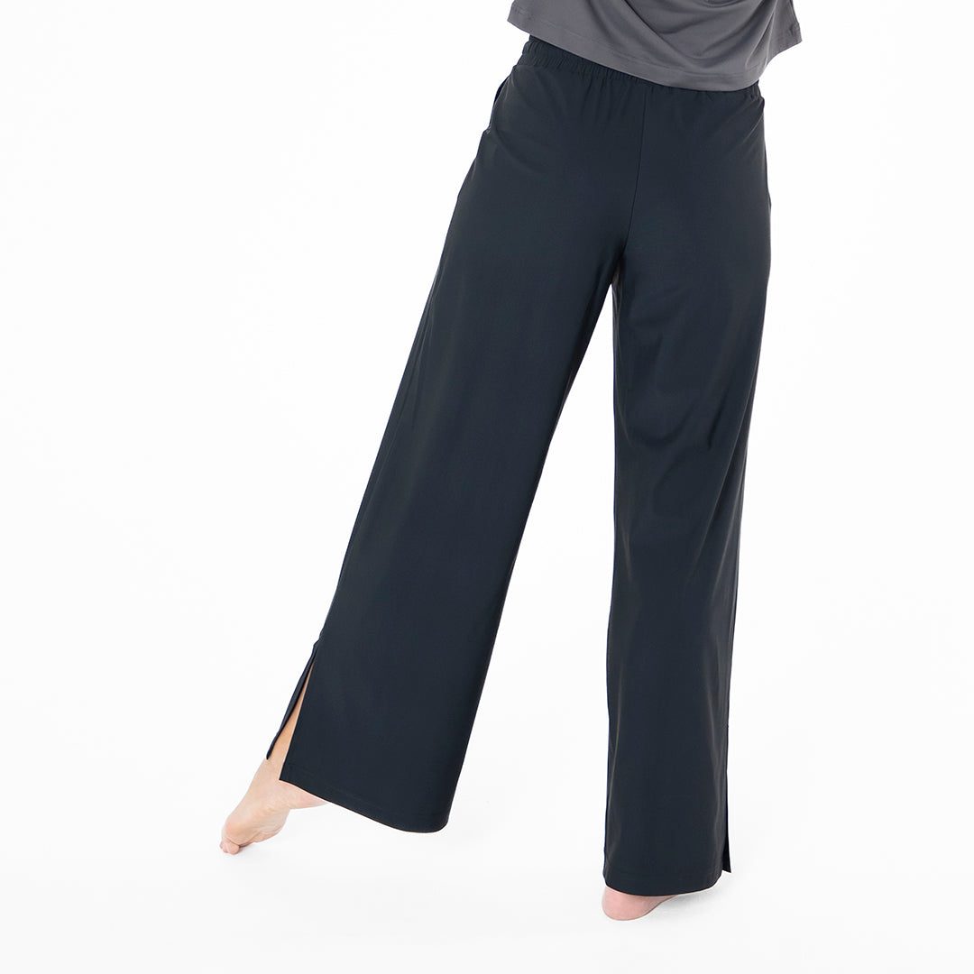 Black wide-leg pants worn by a person on a white background