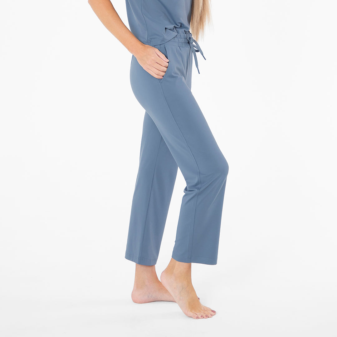 Blue pajama set worn by a person on a white background