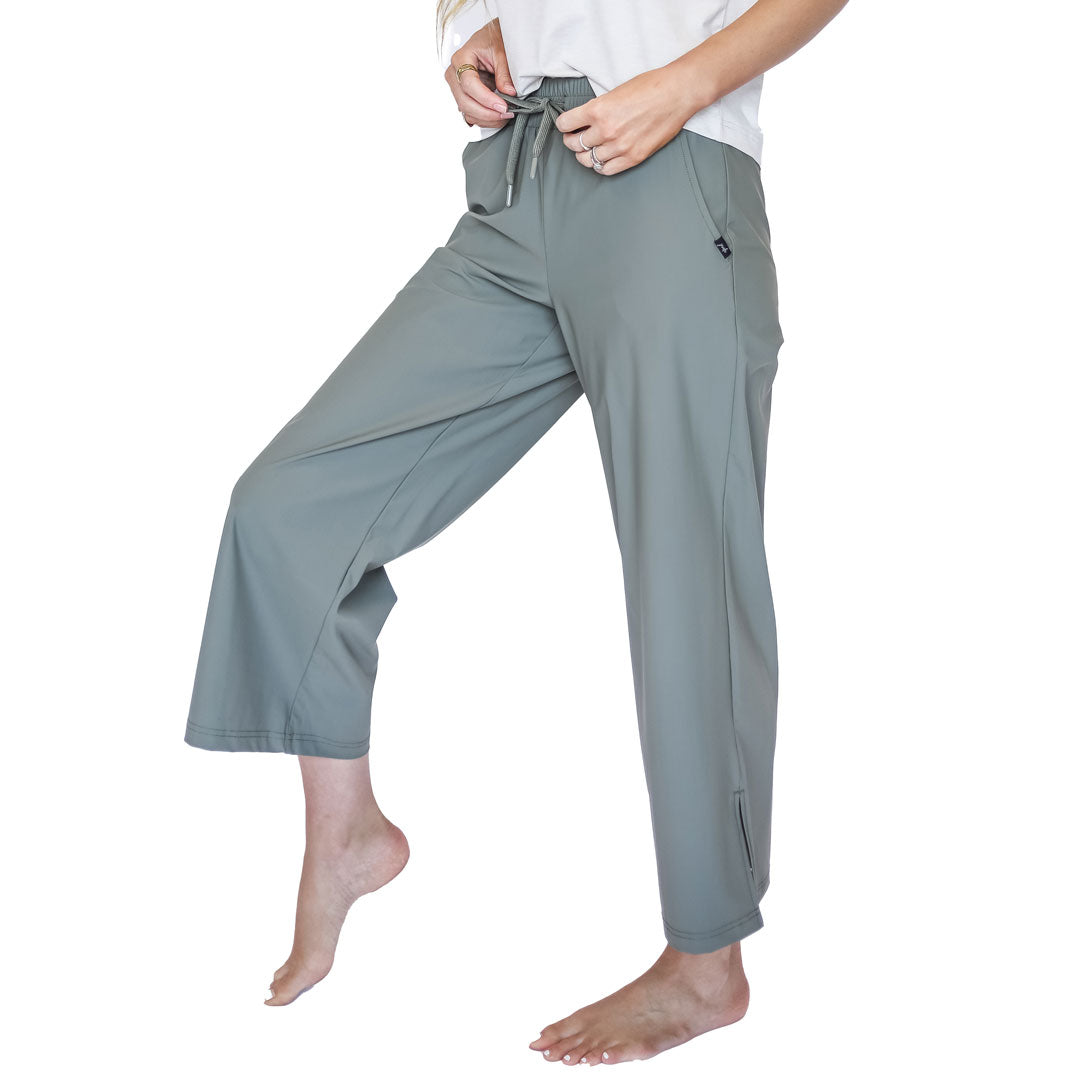 Gray wide-leg pants worn by a person on a white background