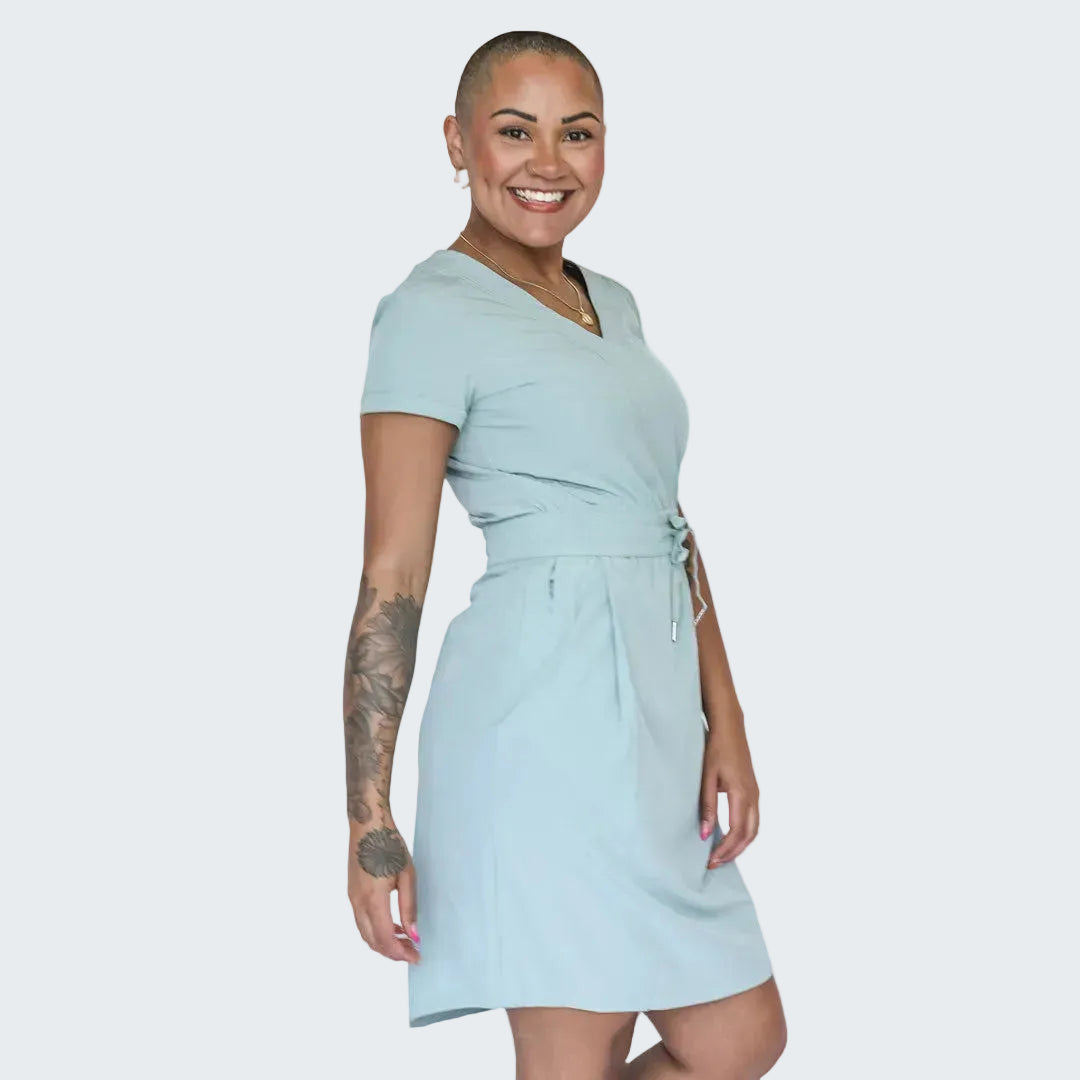 Woman wearing a light blue dress on a white background