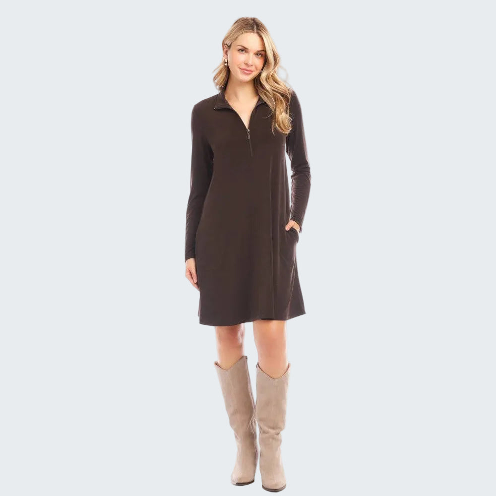 Woman wearing a brown dress with long sleeves on a white background
