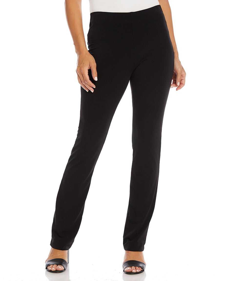 A model wearing black high-waisted straight-leg pants with a white top and black slide sandals, shown from the waist down on a white studio background.