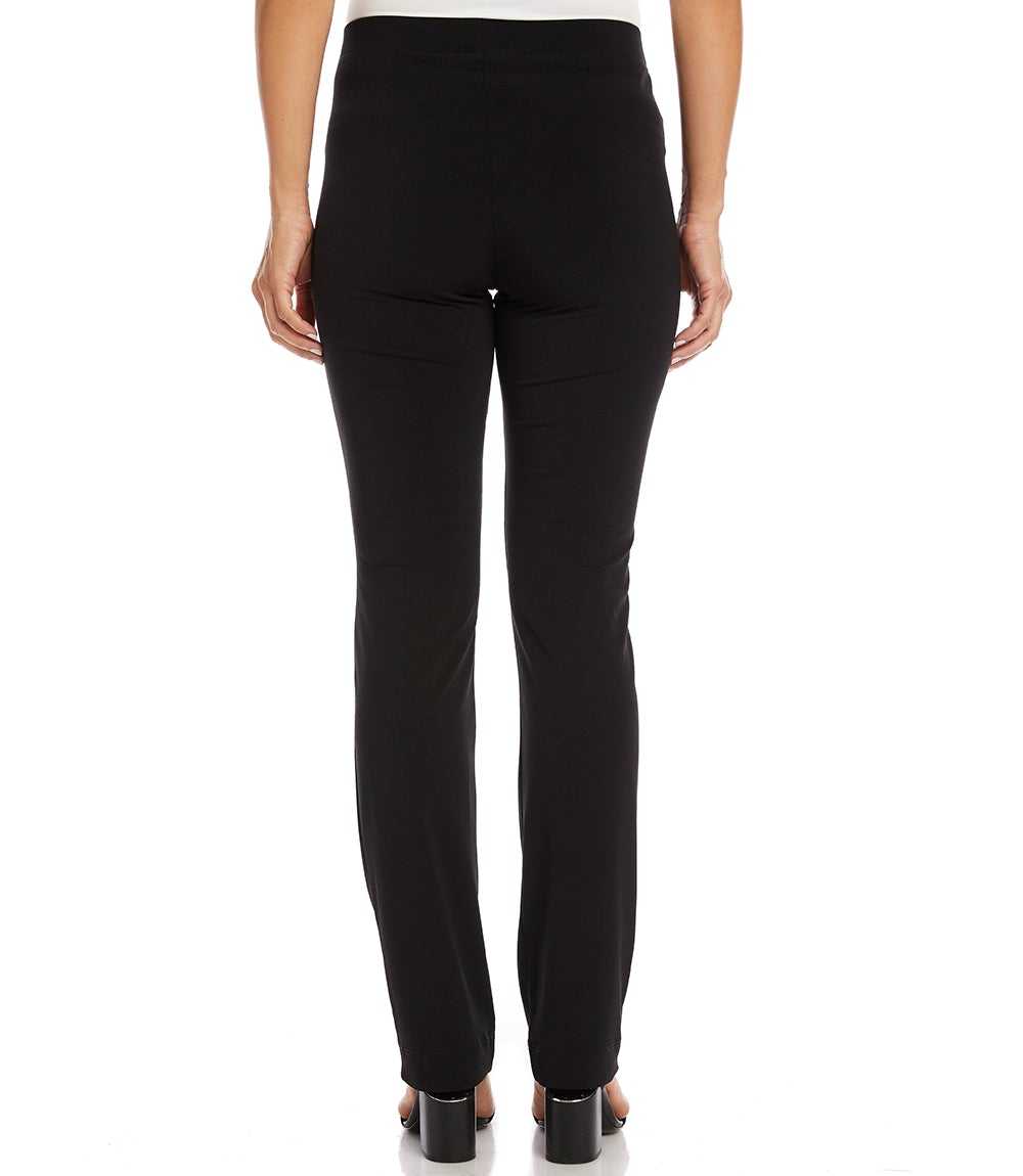 Black high-waisted slim-fit pants shown from the back on a model, featuring a straight leg and a small welt pocket on the upper right hip, paired with black heels against a white background.