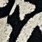 A close-up of a black and white textured pattern, likely a woven fabric or rug texture.