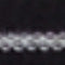 A close-up of a dark textured surface with a horizontal ribbed or wavy pattern in black and very dark gray.