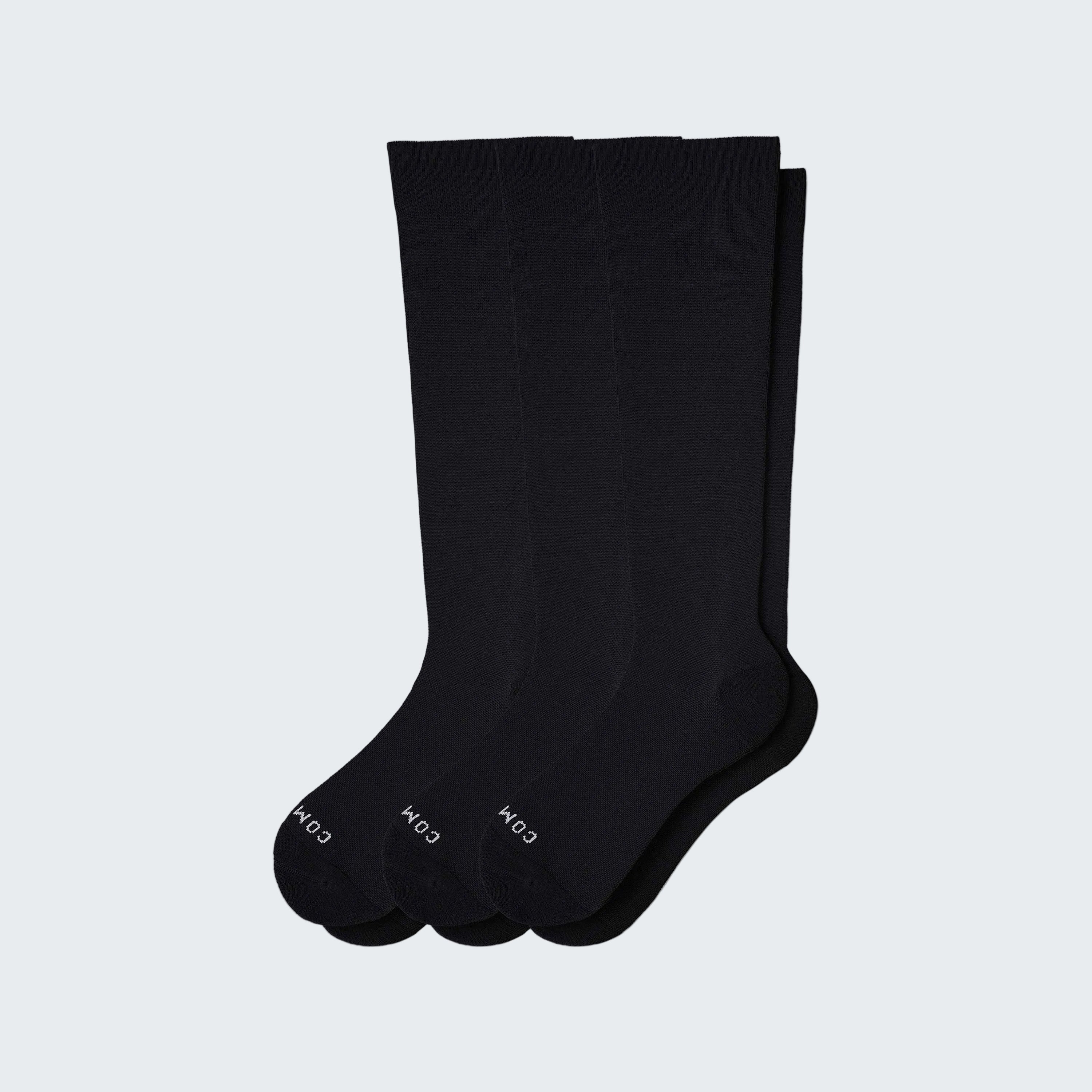 Three black socks on a white background