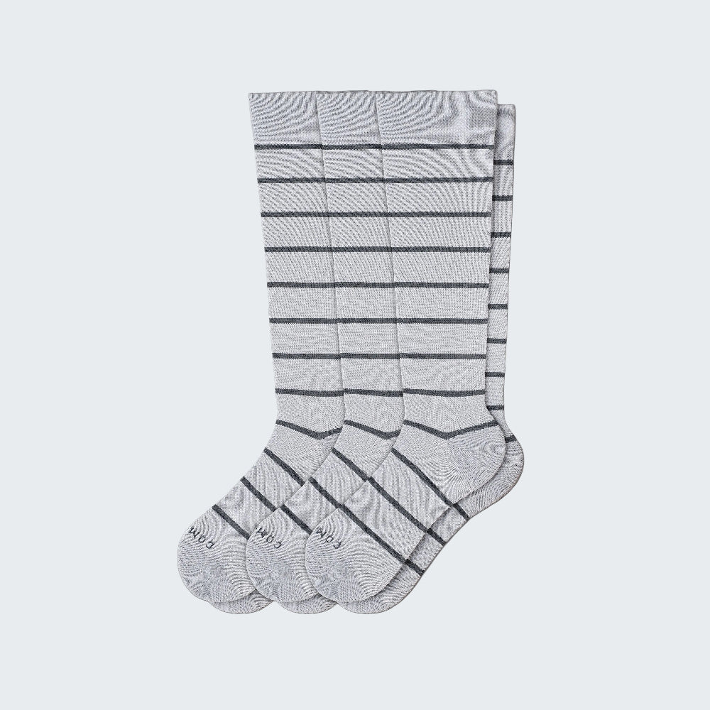 Set of gray knee-high socks with black stripes on a white background