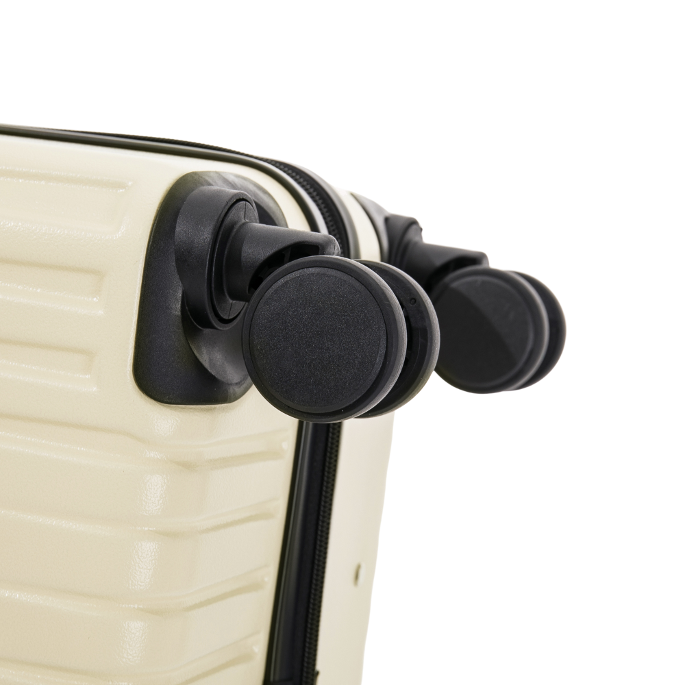 Close-up of a beige suitcase with black handle grips on a white background