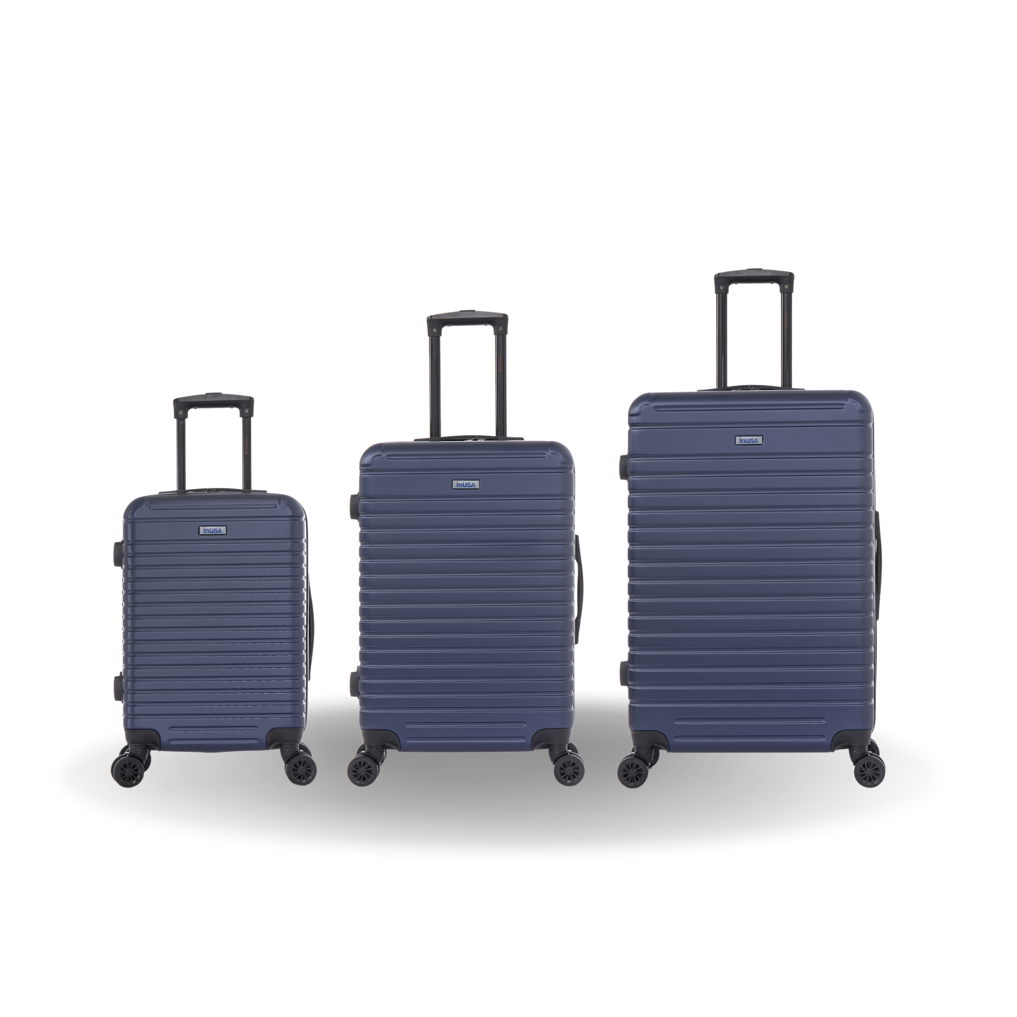 Three navy blue suitcases of different sizes on a white background