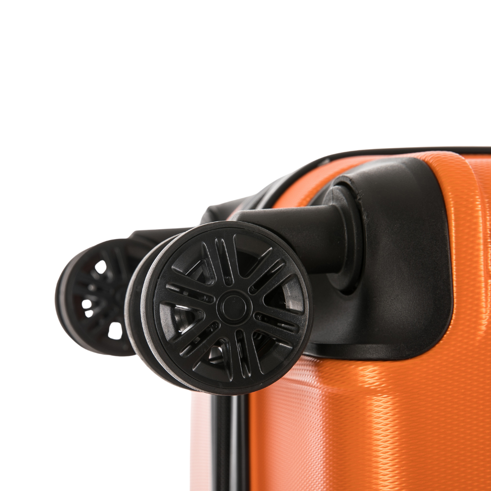 Close-up of an orange suitcase with black wheels on a white background