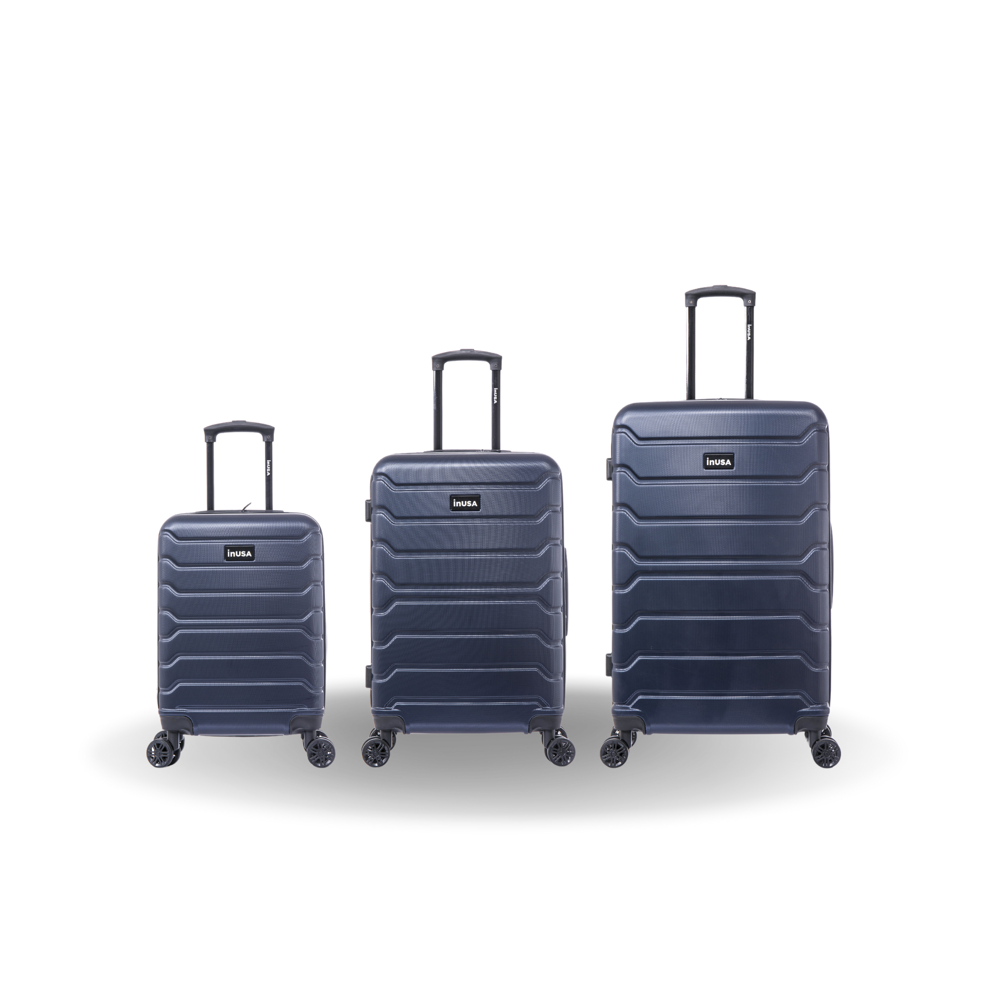 Three navy blue suitcases of different sizes on a white background