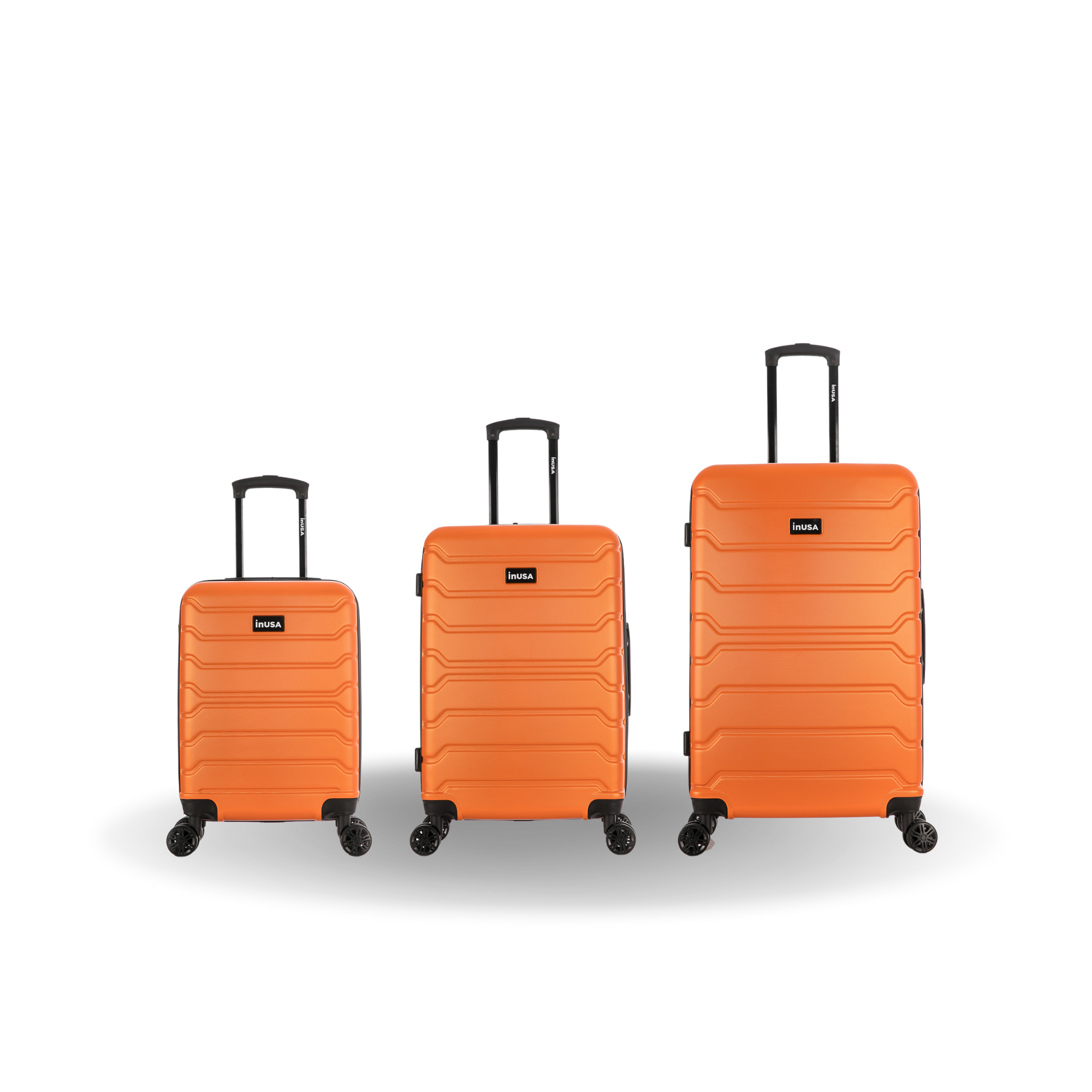 Three orange suitcases of different sizes on a white background