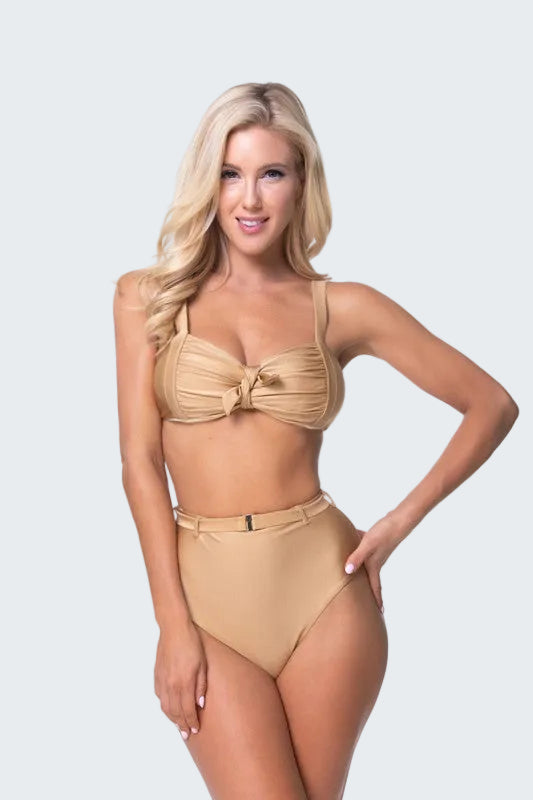 Woman wearing a beige bikini set on a white background