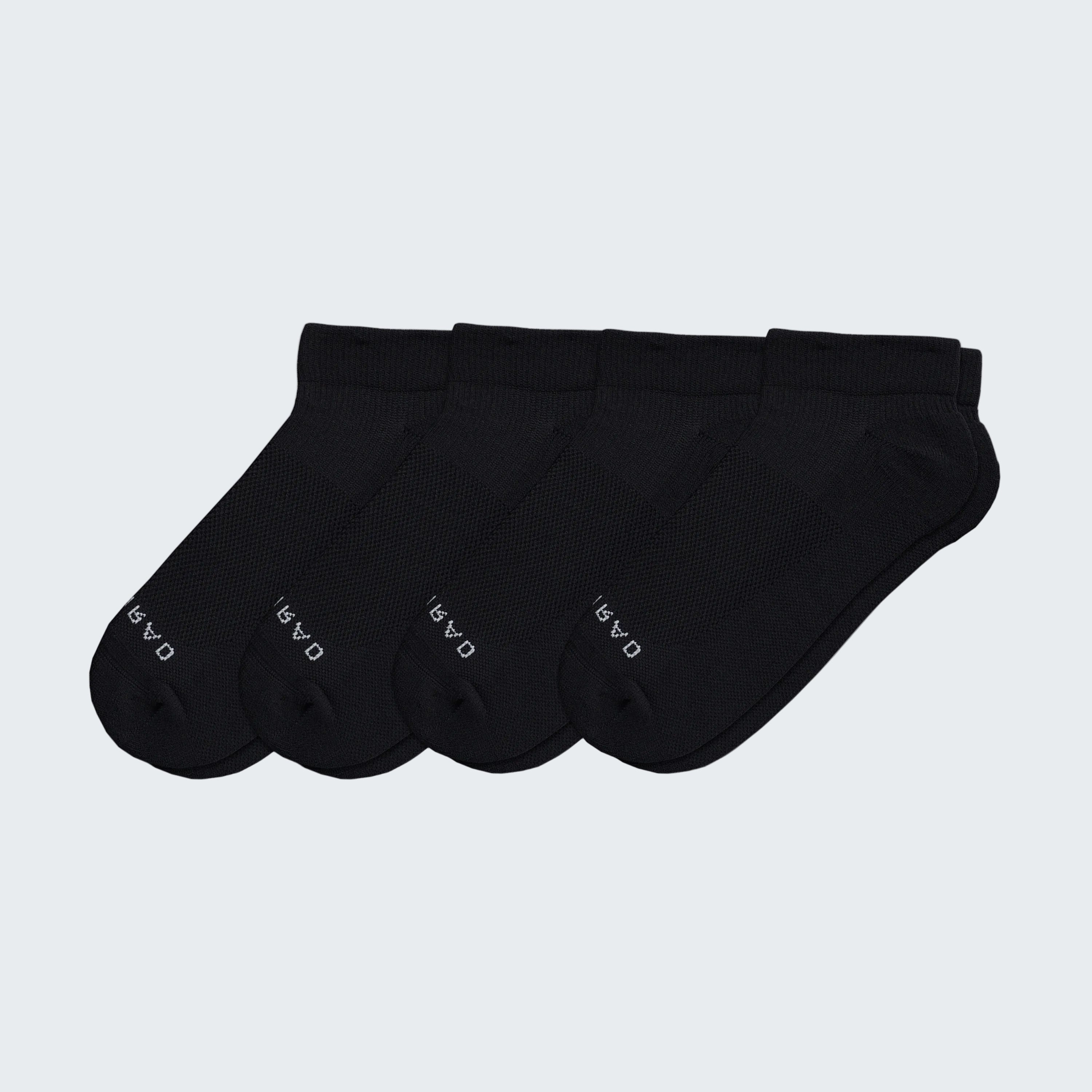 Set of five black ankle socks on a white background