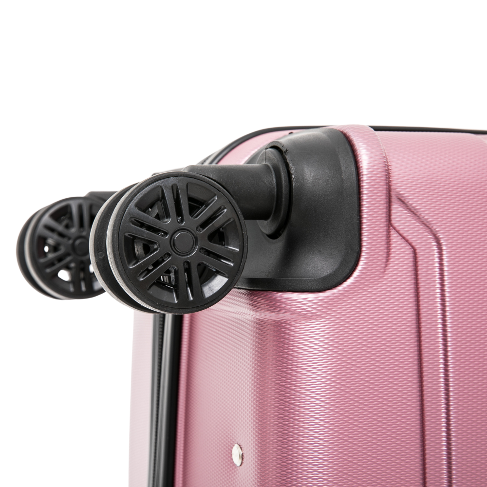 Close-up of a pink suitcase with black wheels on a white background