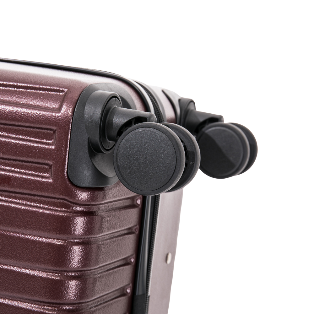 Close-up of a brown suitcase with black wheels on a white background