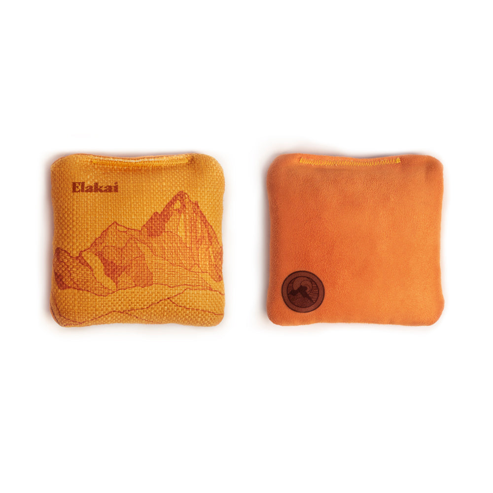 Two orange bean bags with Elakai branding on a white background