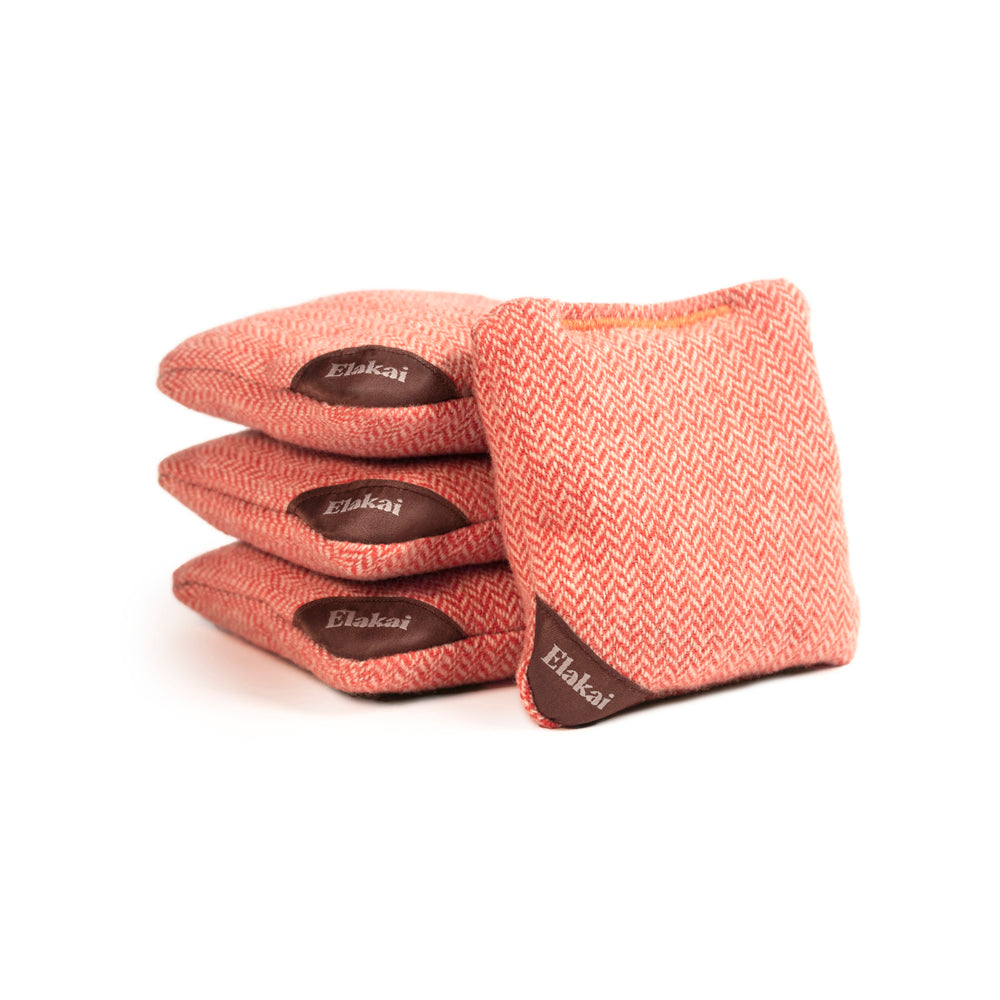 Set of pink bean bags with 'Elakai' branding on a white background