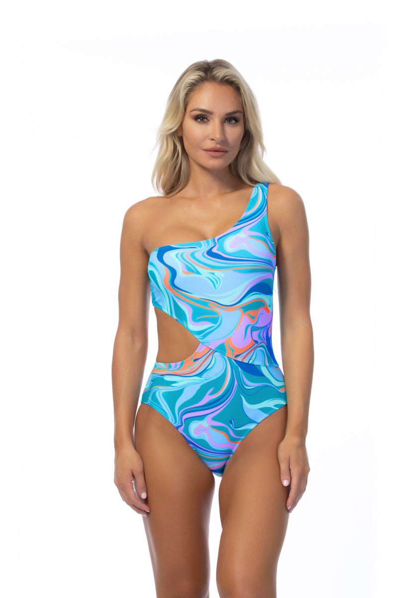Woman wearing a colorful one-piece swimsuit on a white background