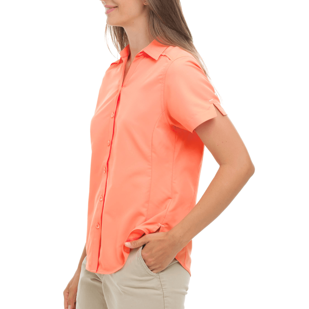 Woman wearing a bright orange button-up shirt on a white background