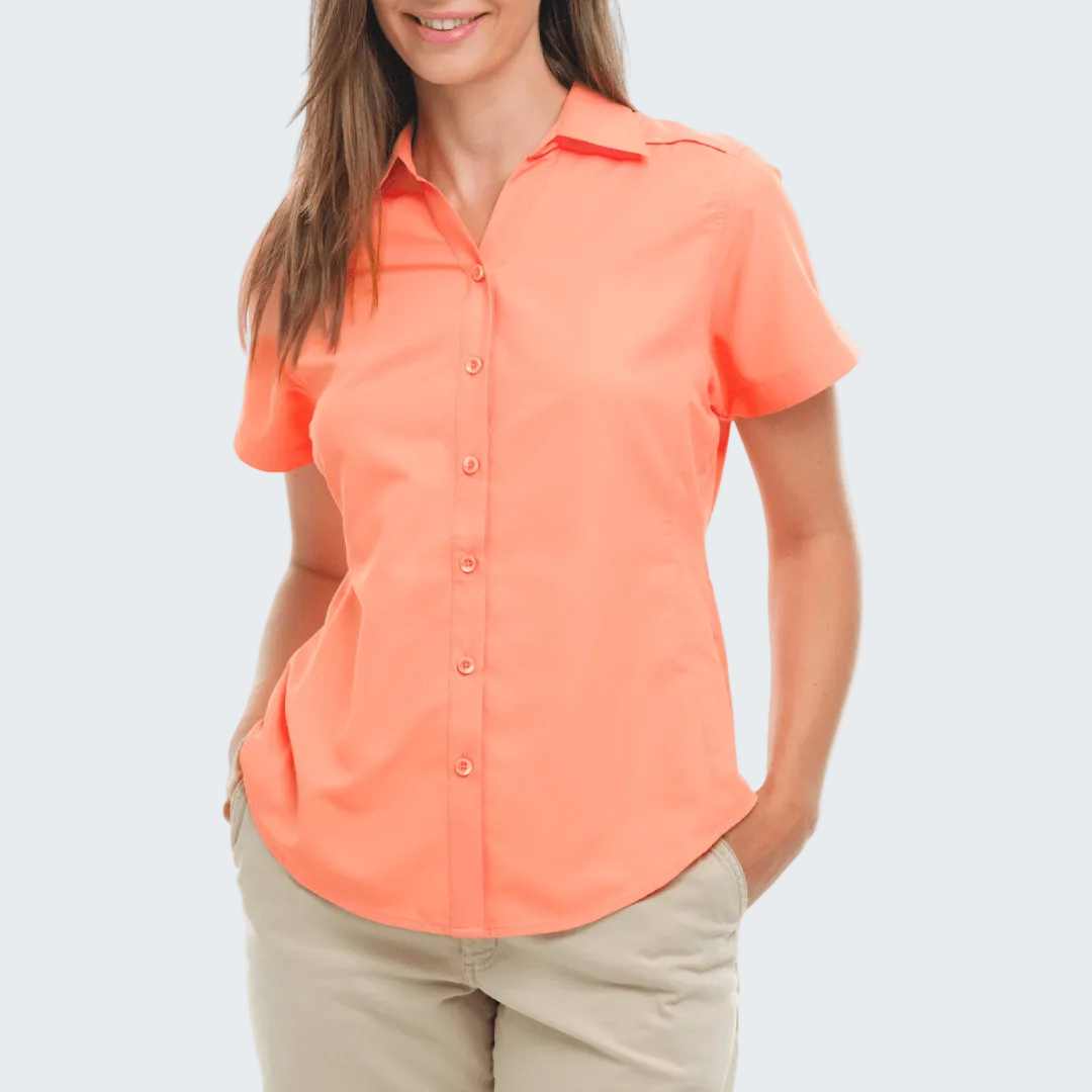 Woman wearing a coral short-sleeve shirt on a white background