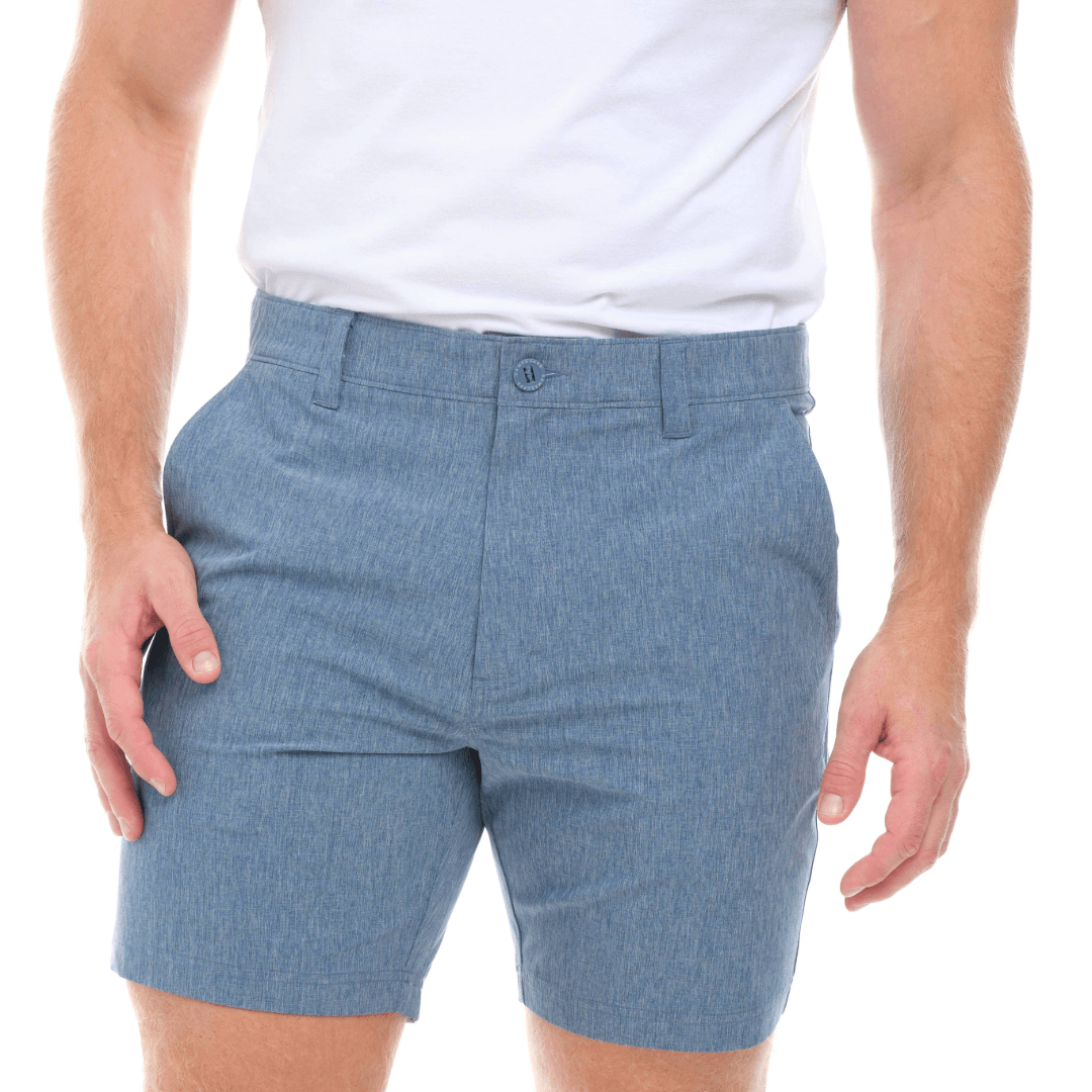 Blue shorts worn by a person on a white background