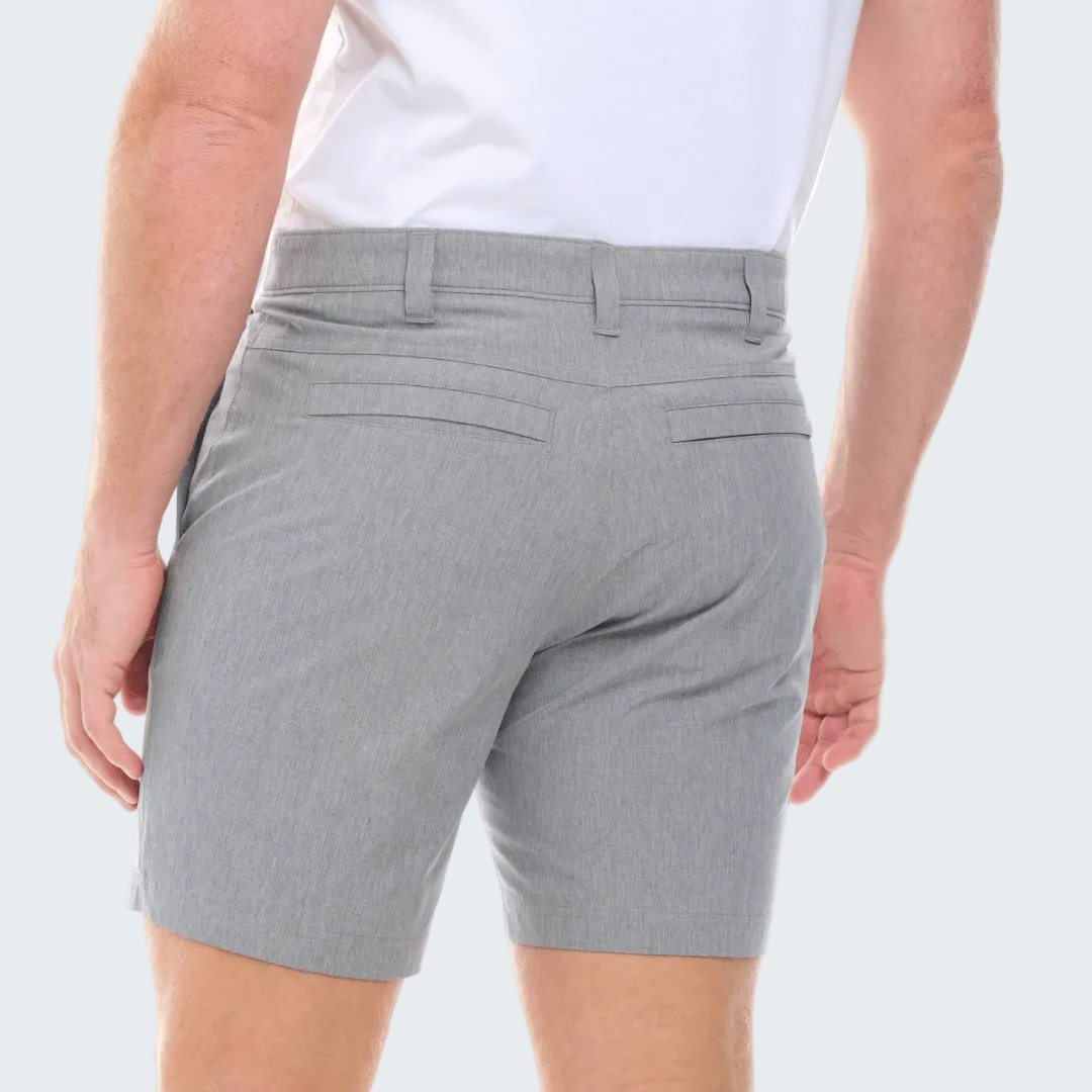 Gray shorts worn by a person on a white background