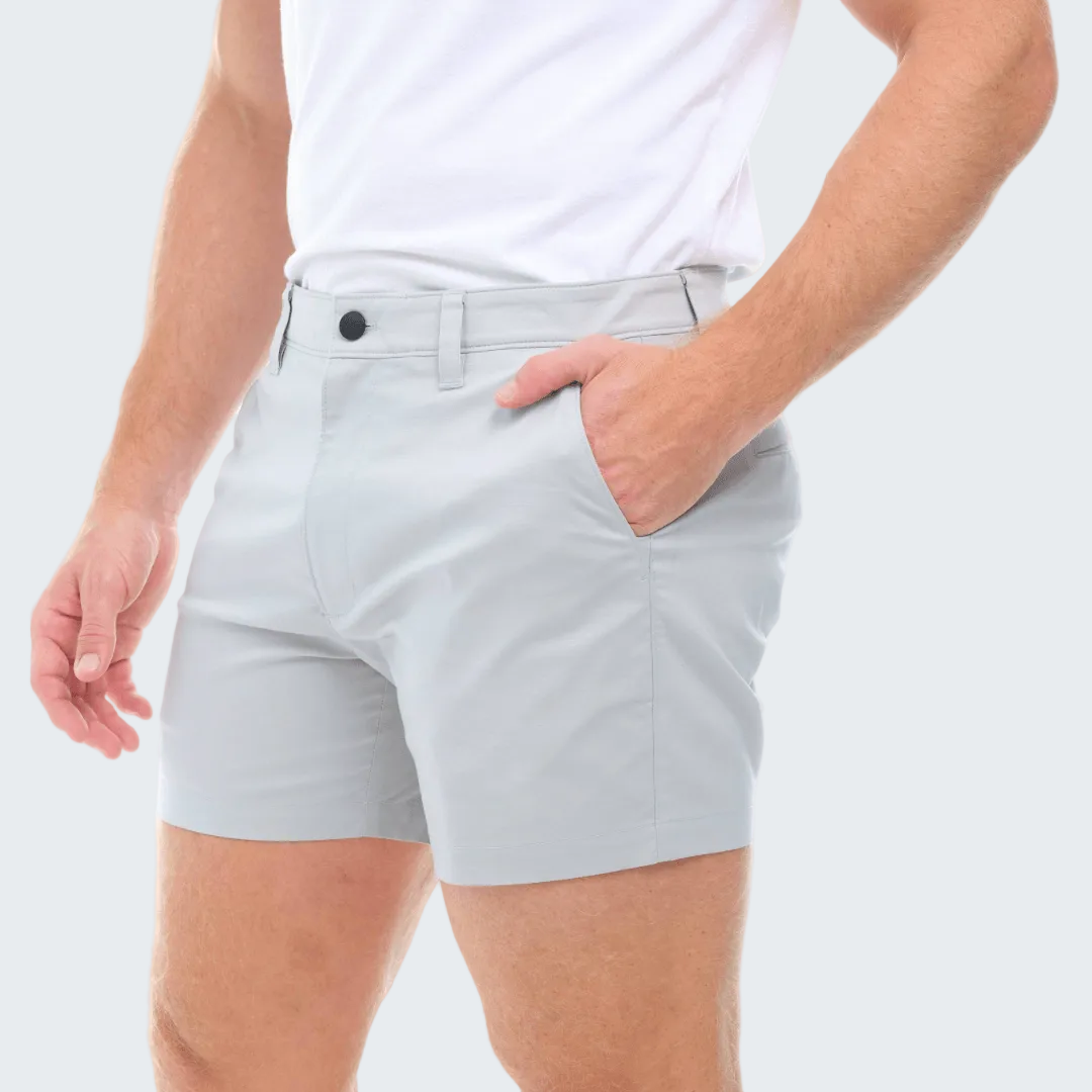 Light gray shorts worn by a person on a white background