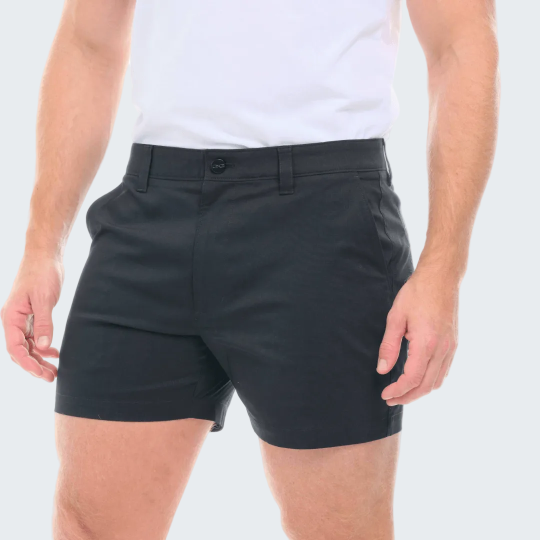 Person wearing black shorts on a white background