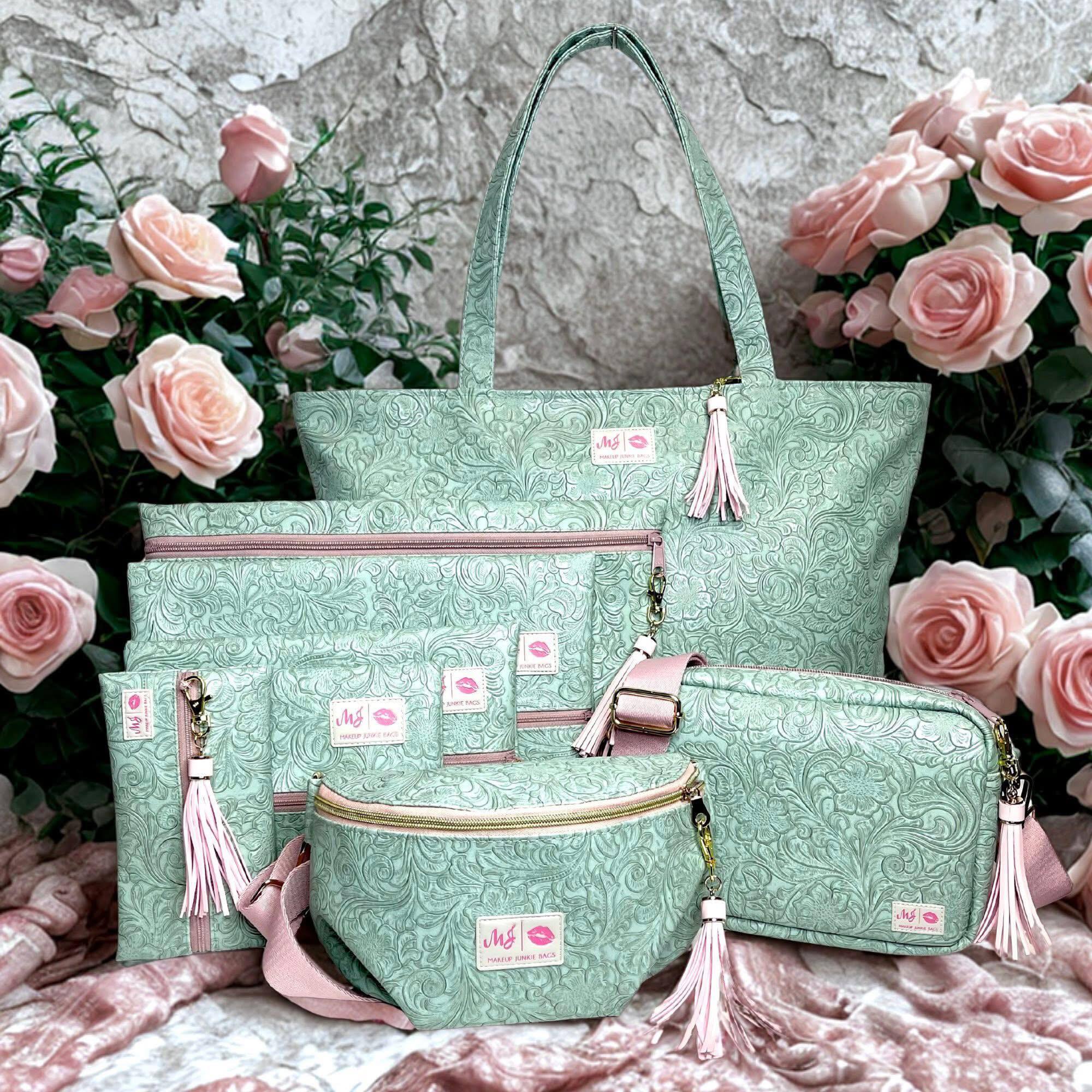 Set of green patterned bags with pink accents on a floral background