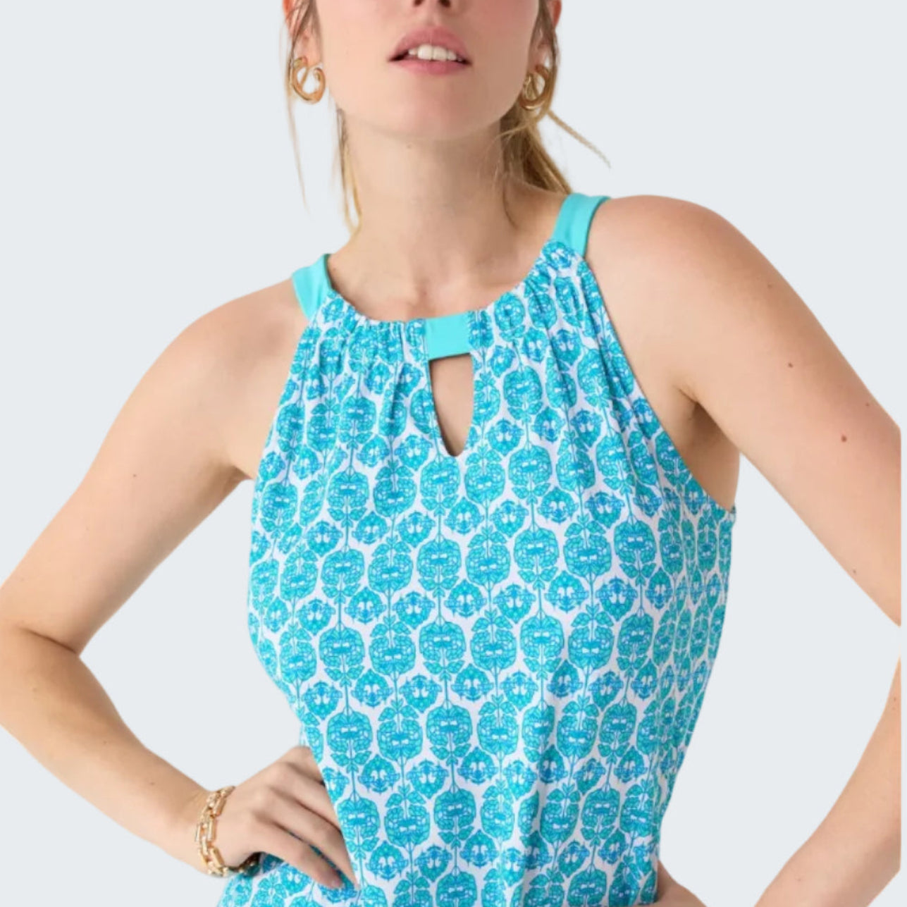 Woman wearing a blue floral dress on a white background