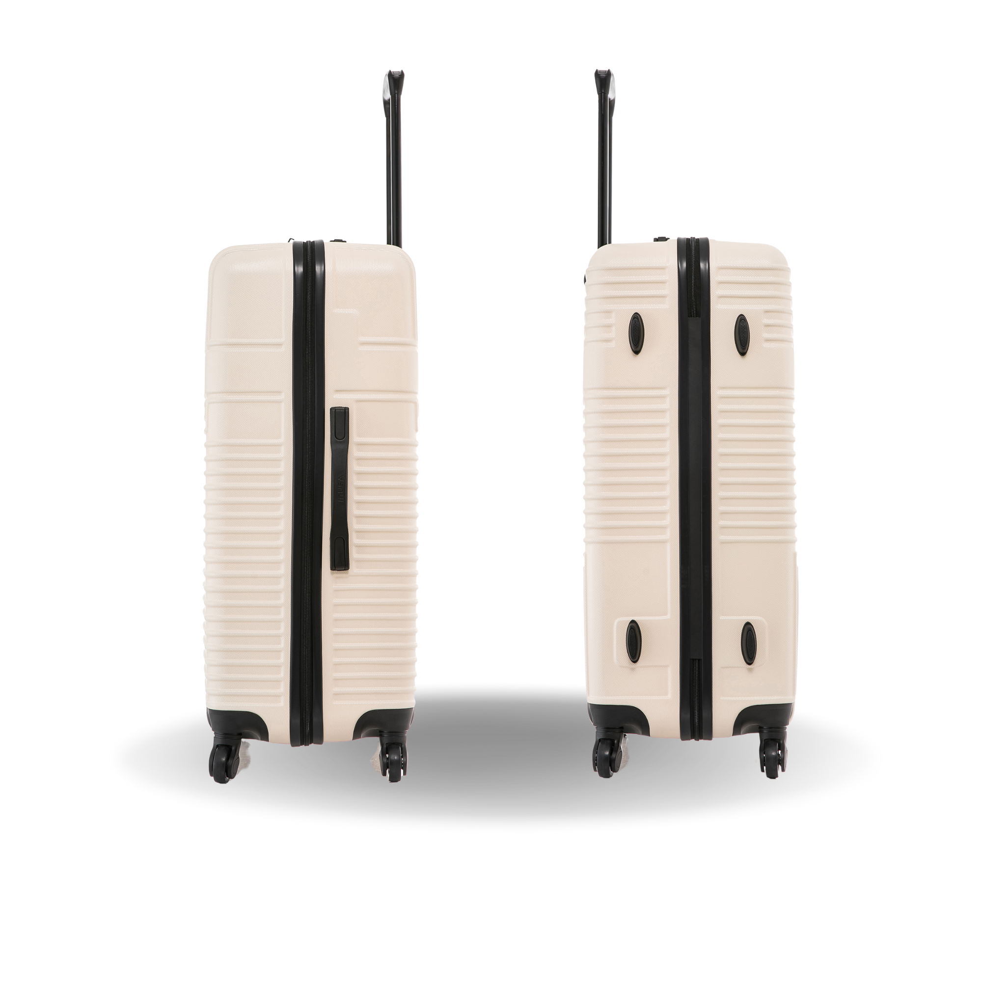 Two beige suitcases with black accents on a white background
