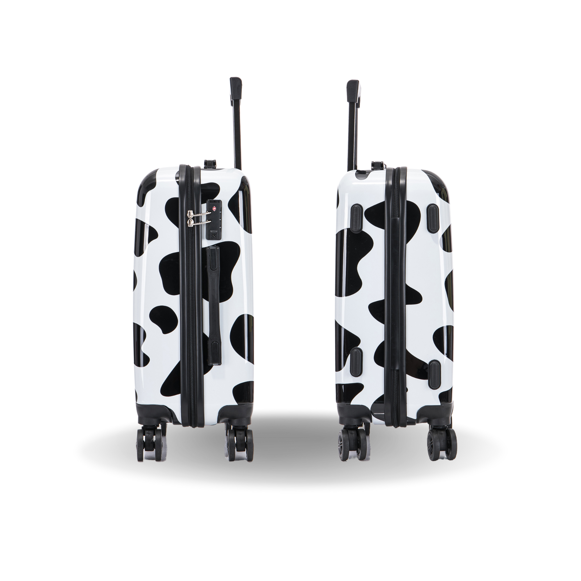 Two black and white polka dot suitcases on a white background