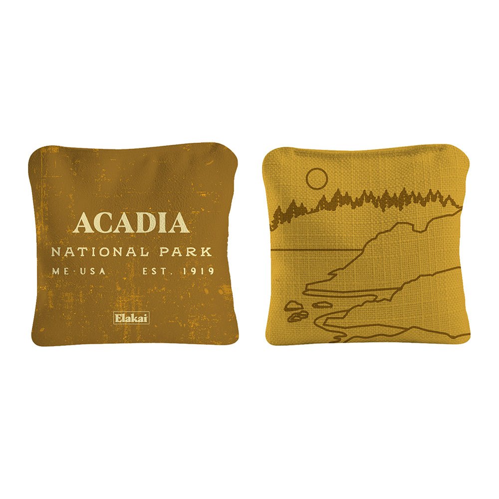 Two yellow pillows with 'Acadia National Park' text and a nature illustration on a white background.