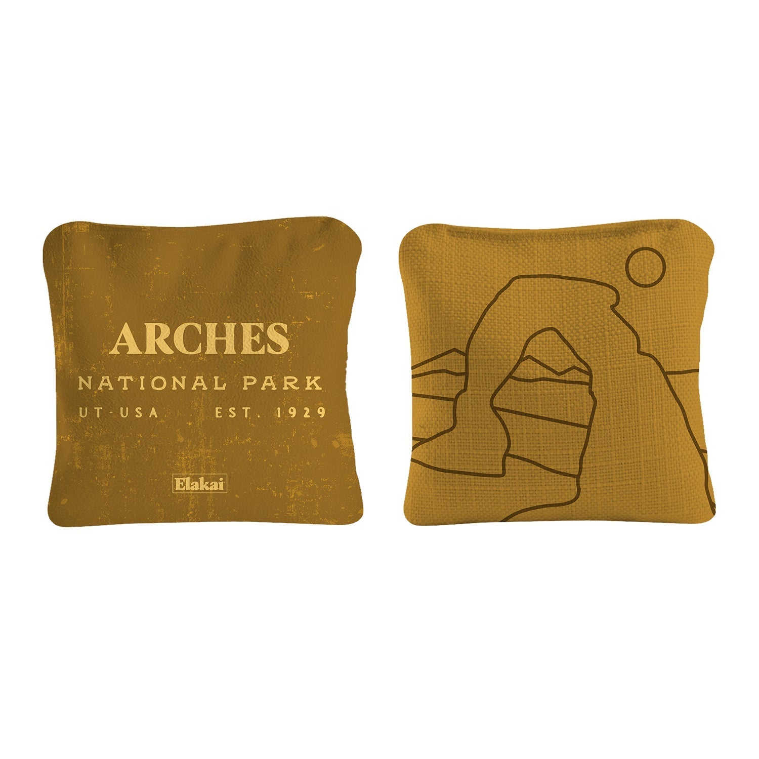 Two mustard-colored pillows with 'Arches National Park' text and logo on a white background