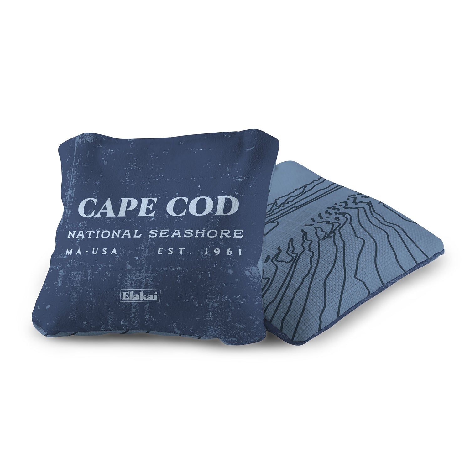 Blue pillow with 'Cape Cod National Seashore' text and Elakai branding on a white background