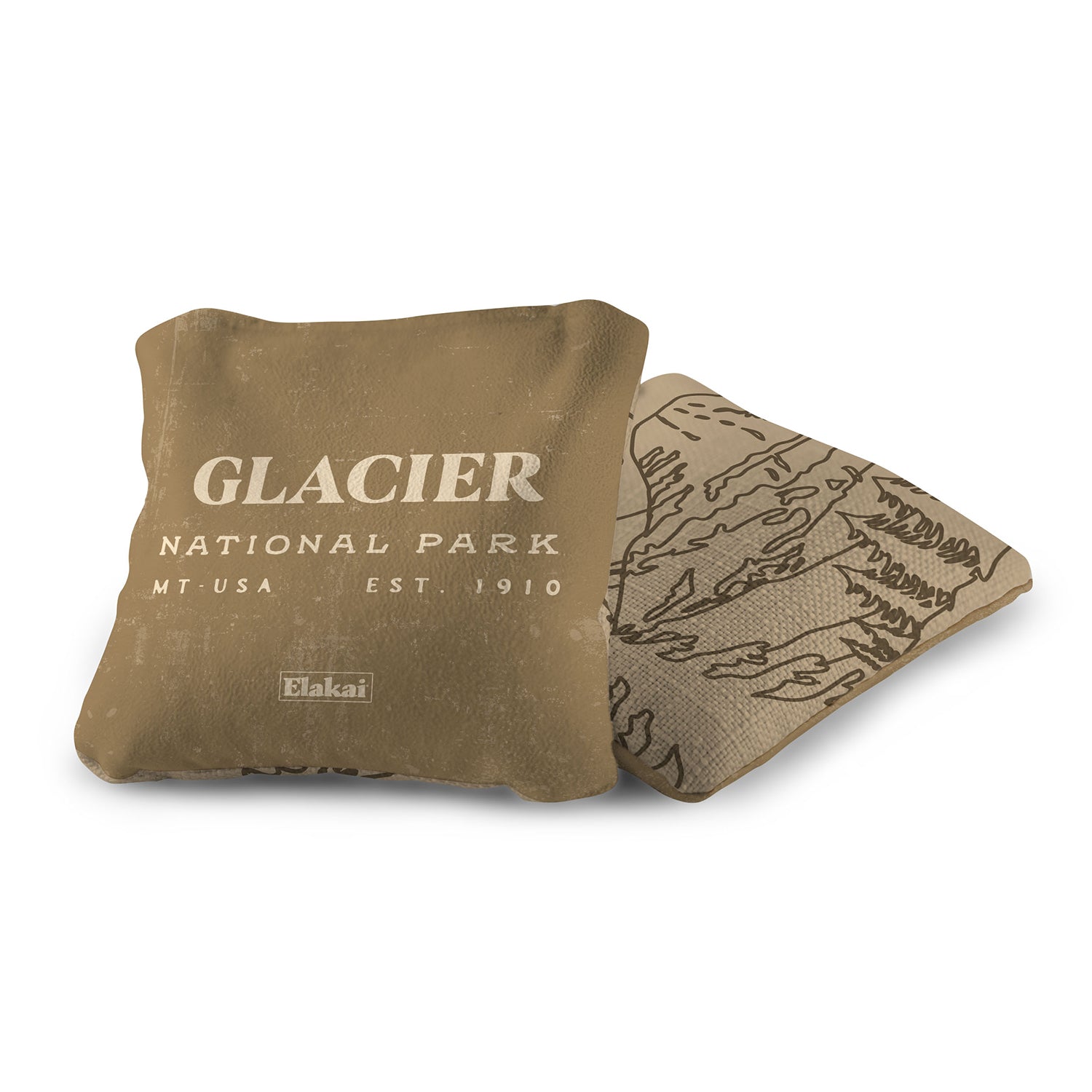 Brown pillow with 'Glacier National Park' text on a white background