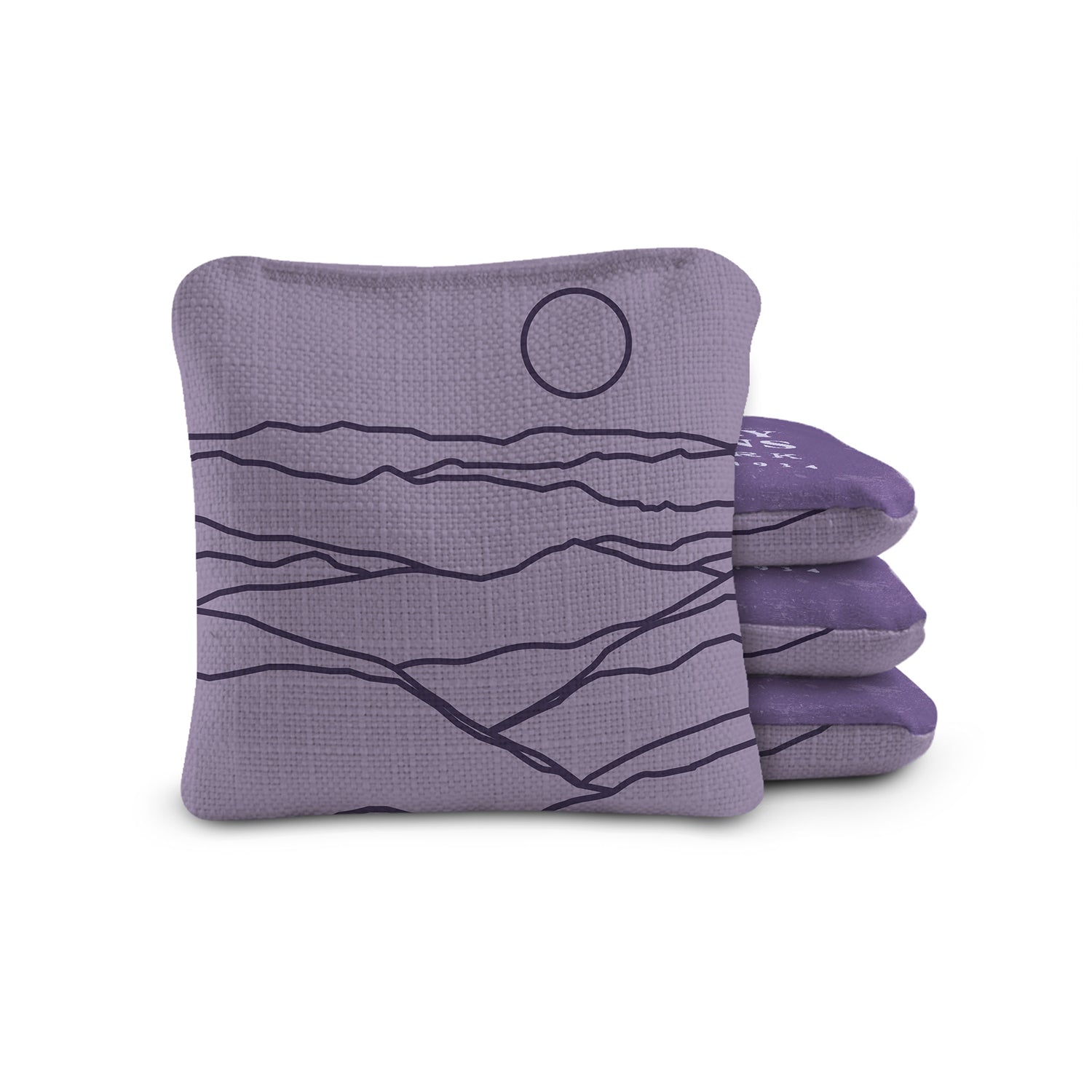 Purple cornhole bags with landscape design on a white background