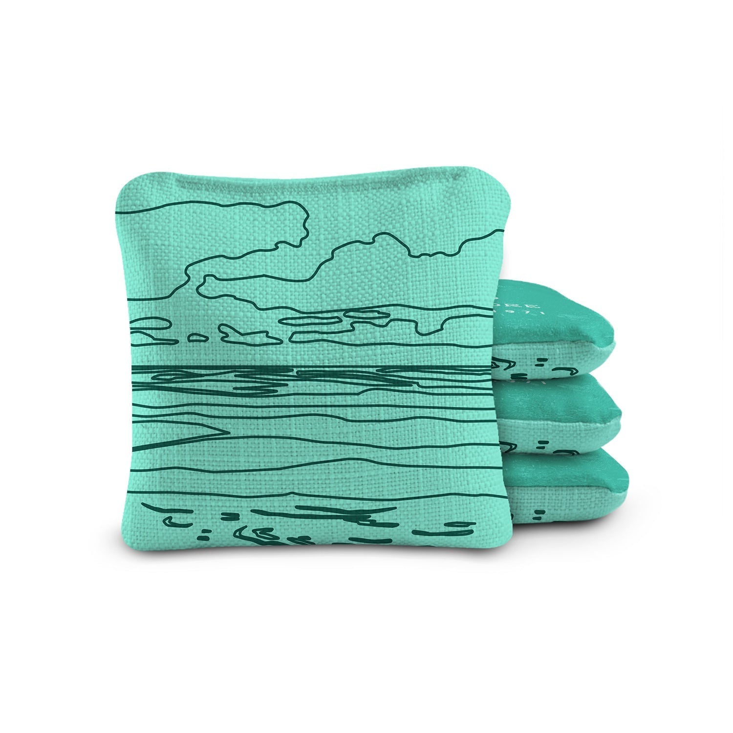 Stack of teal cornhole bags with black line design on a white background