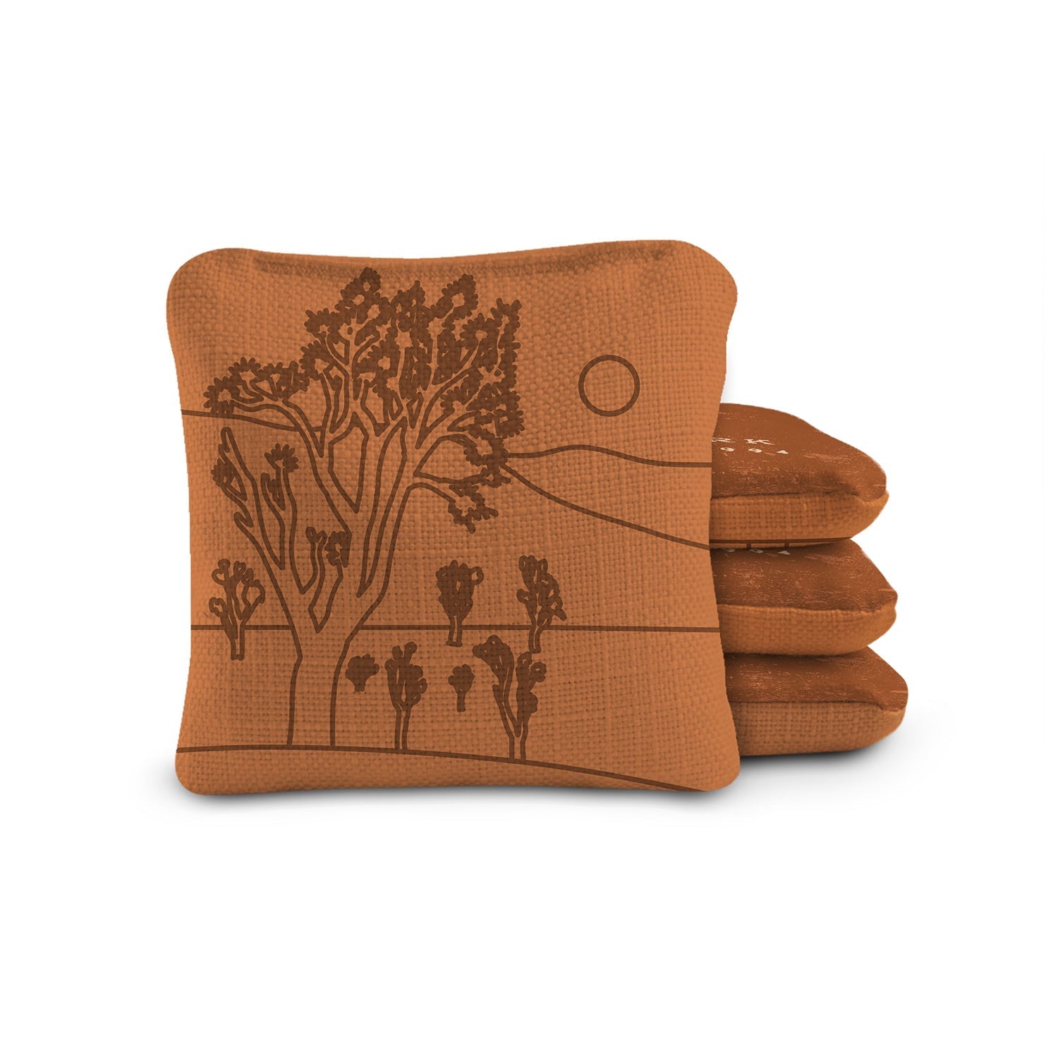Stack of brown folded towels with a nature-themed design on a white background