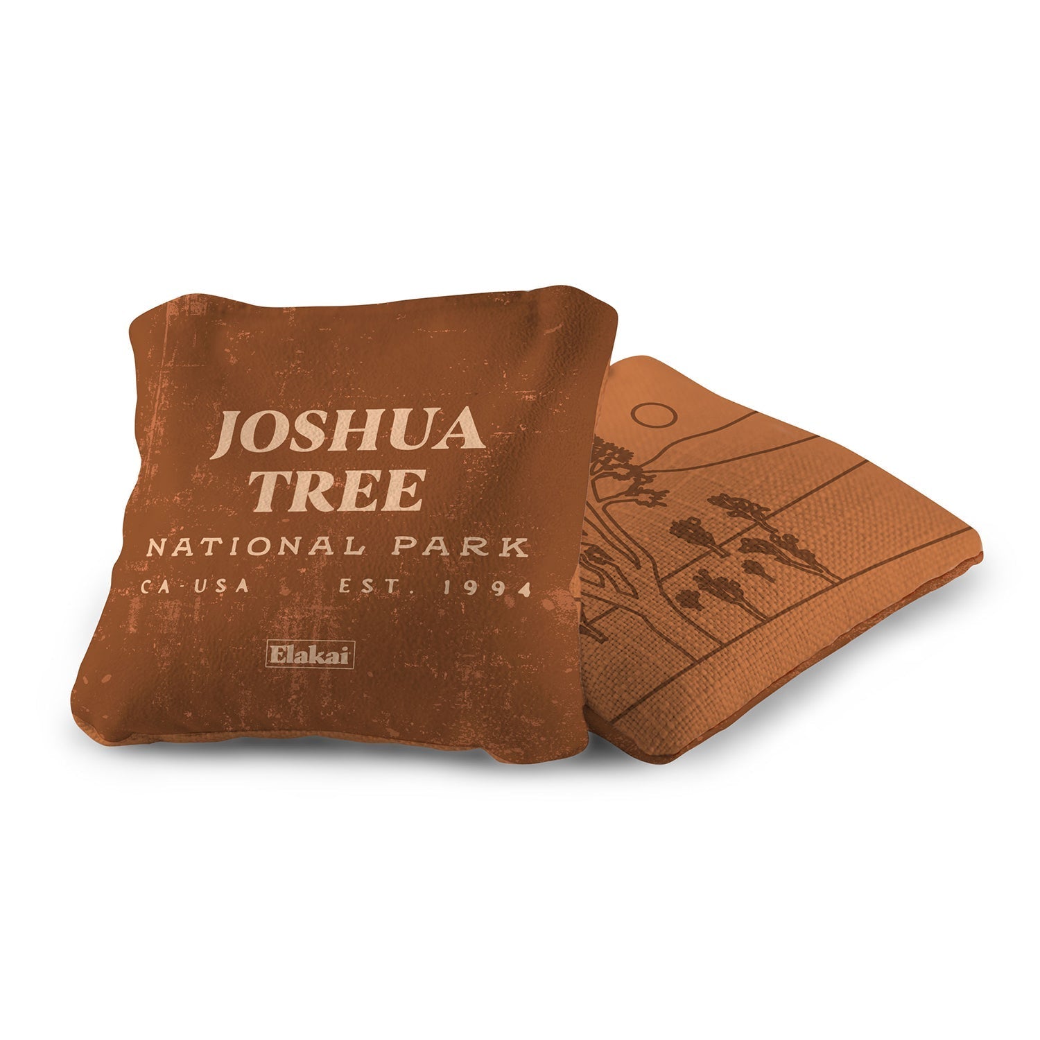 Brown pillow and coaster set with 'Joshua Tree National Park' text on a white background