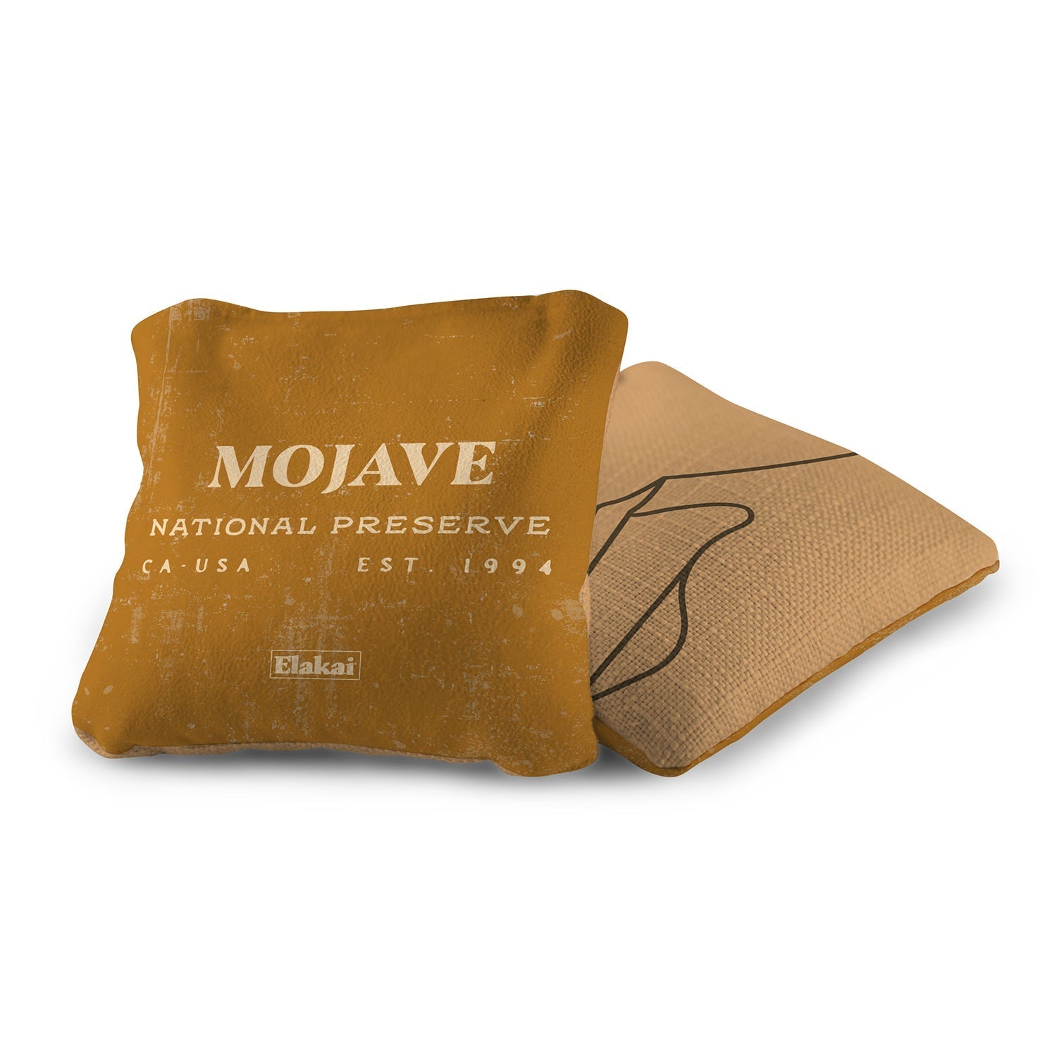 Brown pillow with 'Mojave National Preserve' text on a white background